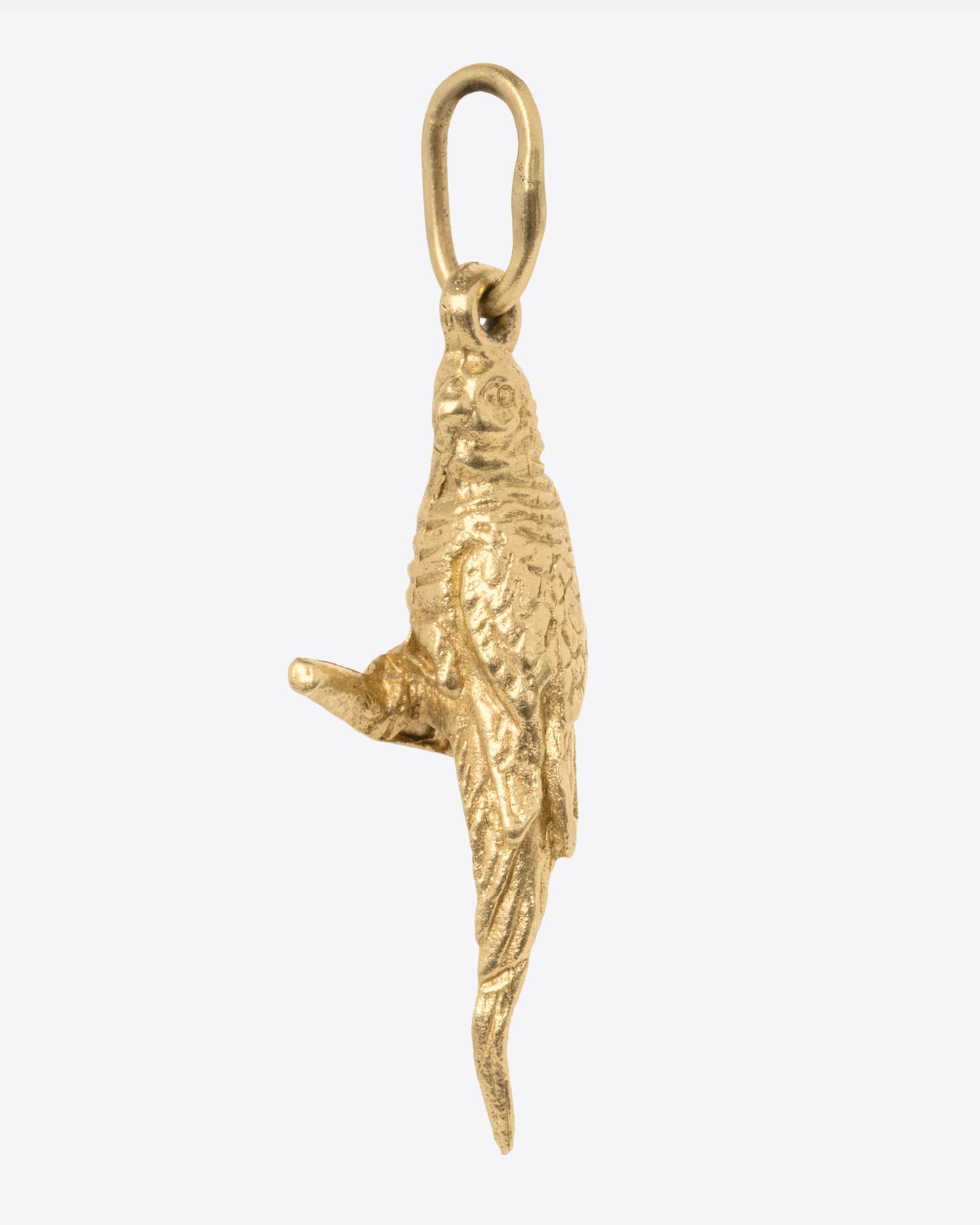 A yellow gold parrot charm, shown from the side.