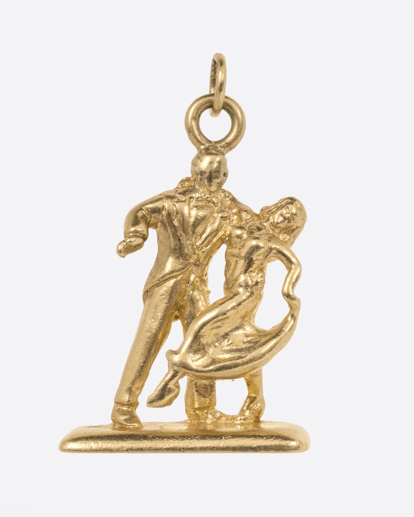 A yellow gold charm with dancing couple, shown from the front.