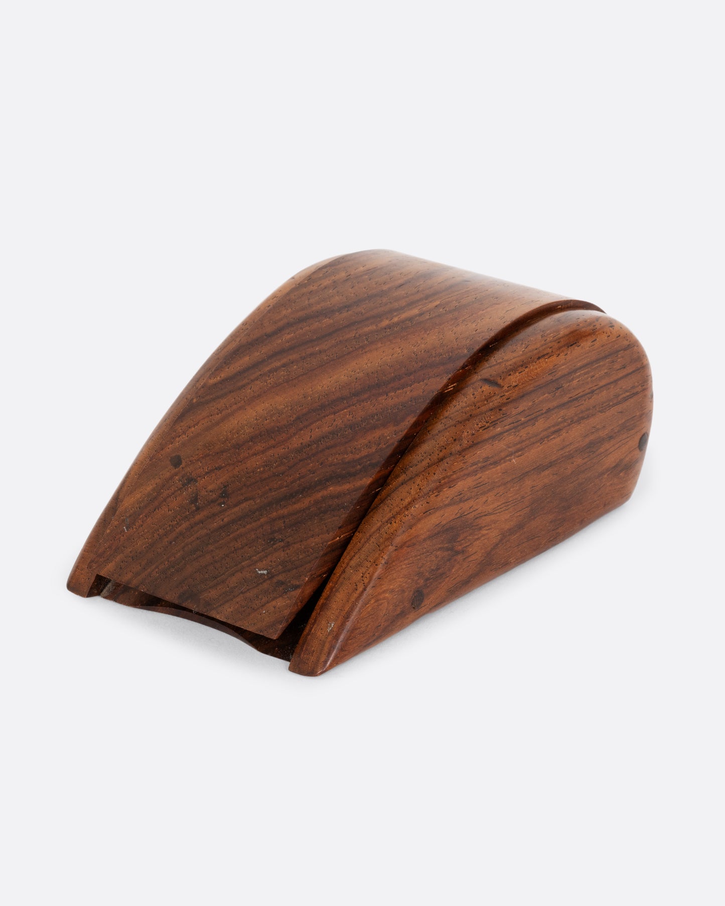 A curved wooden box shown closed from the front.