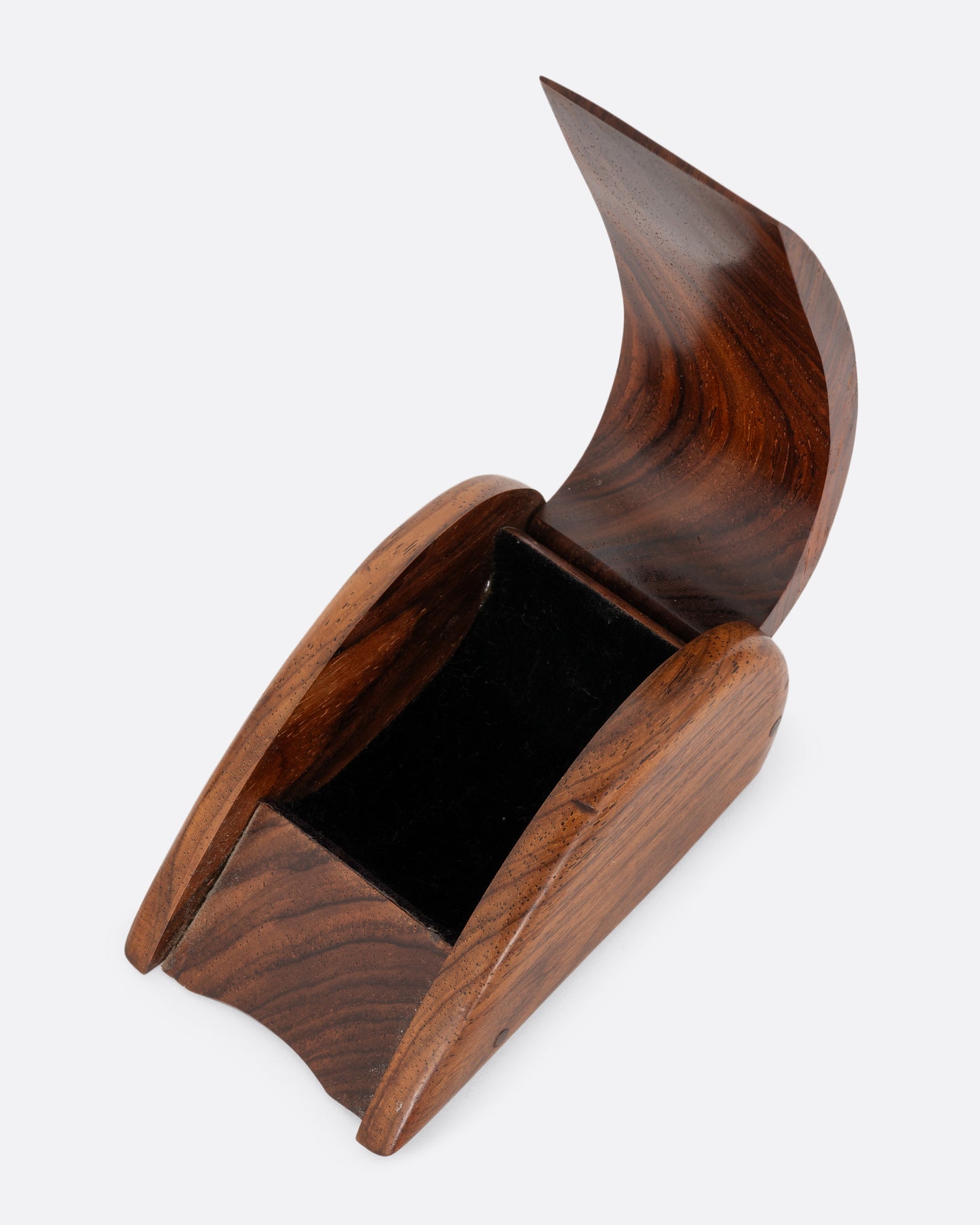 A curved wooden box with a velvet- lined interior. Shown open from the top.