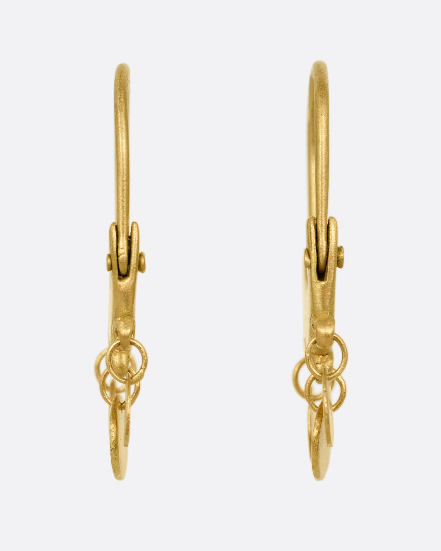 A pair of yellow gold chandelier hoop earrings shown from the front.