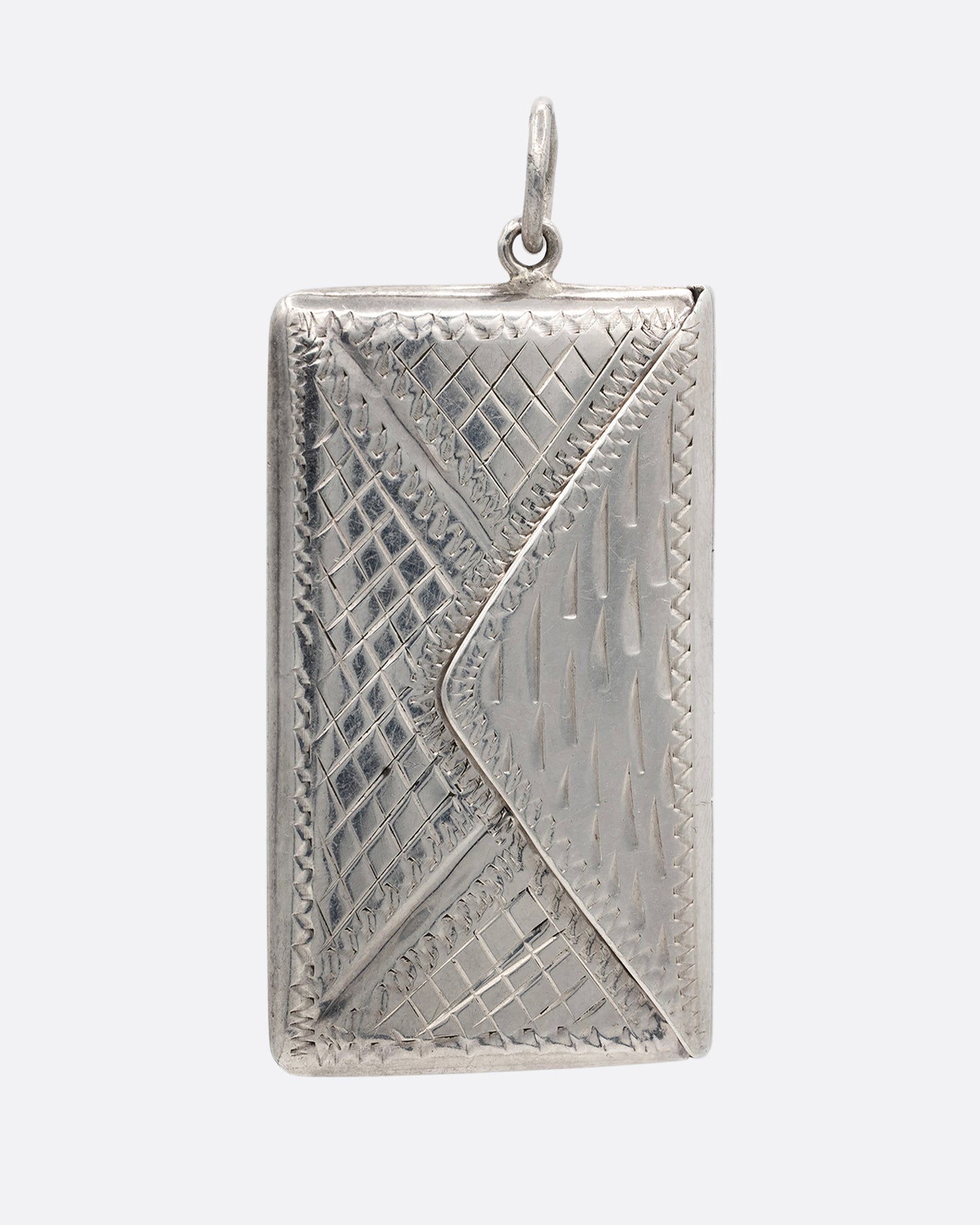 A silver textured envelope locket. Shown from the front.