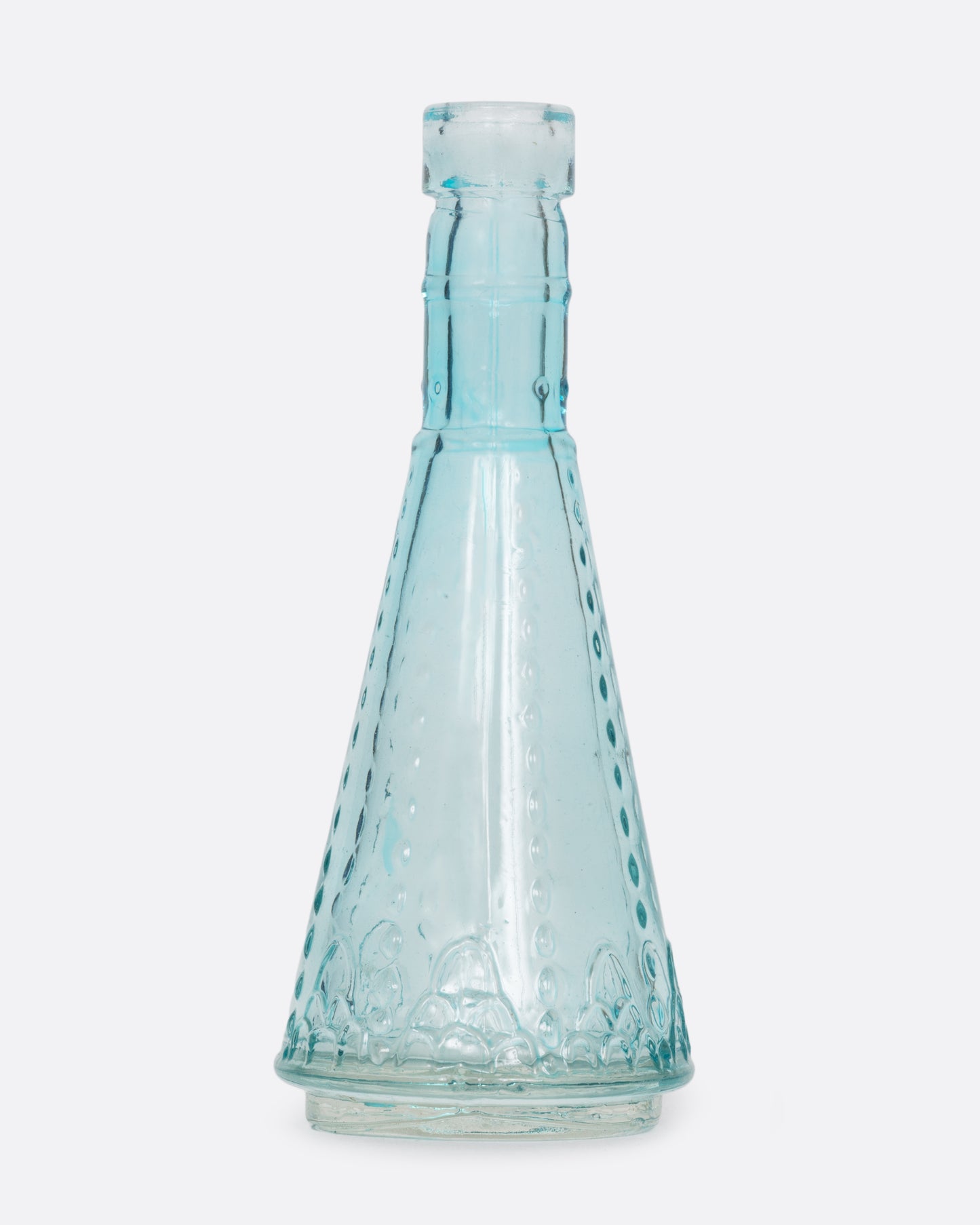 A tiny clear blue glass vase in a funnel shape with a bubbly texture. Shown from the front.