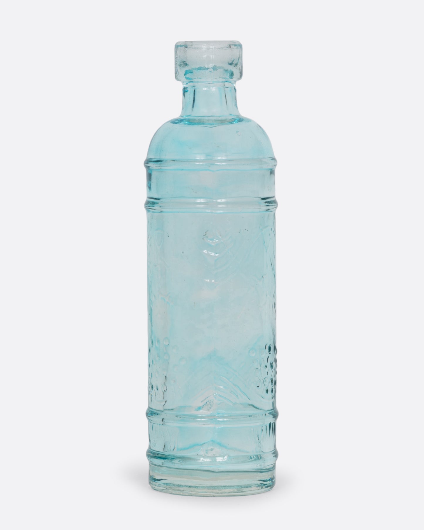 A tiny clear aqua glass bud vase shown from the front.