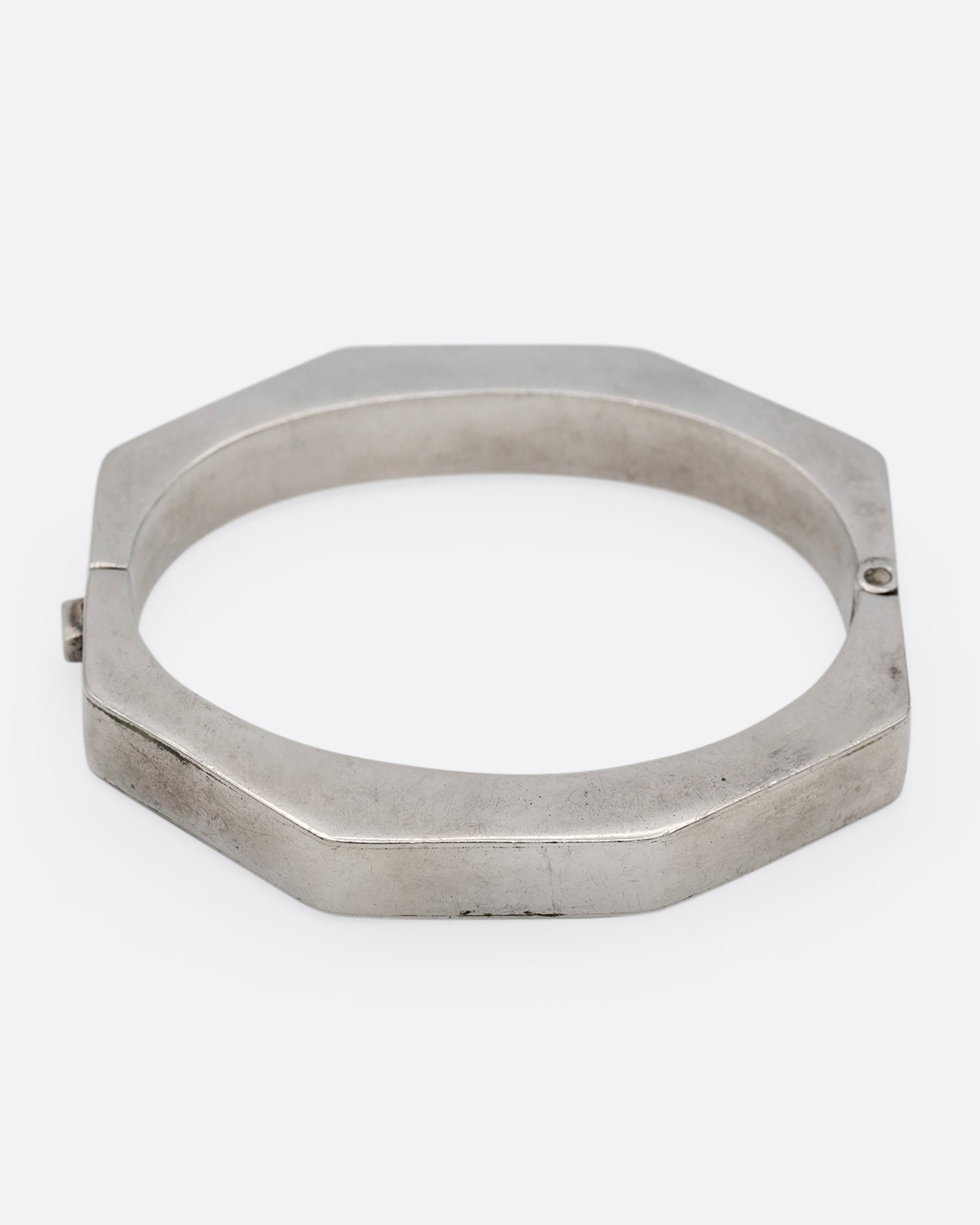 A silver octagonal bangle bracelet, shown from the front.
