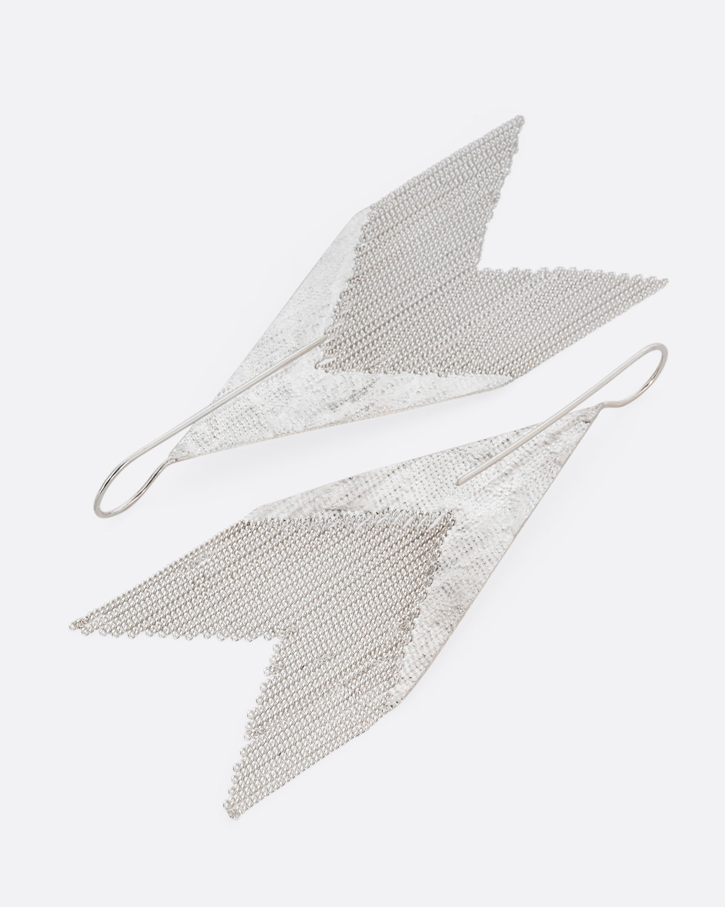 A pair of arrow shaped silver dangle earrings with cable chain fringe. Shown from the back.