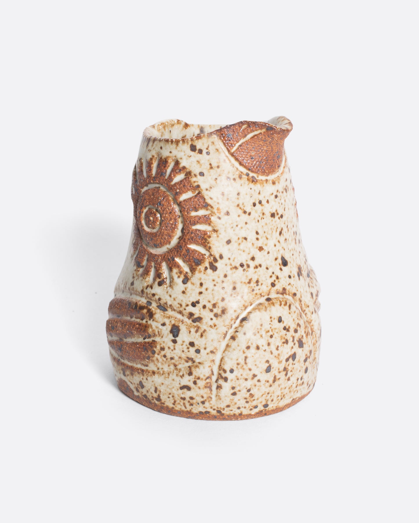 A handmade ceramic bird creamer, full of personality, with an impressionist design and speckled, satin glaze.