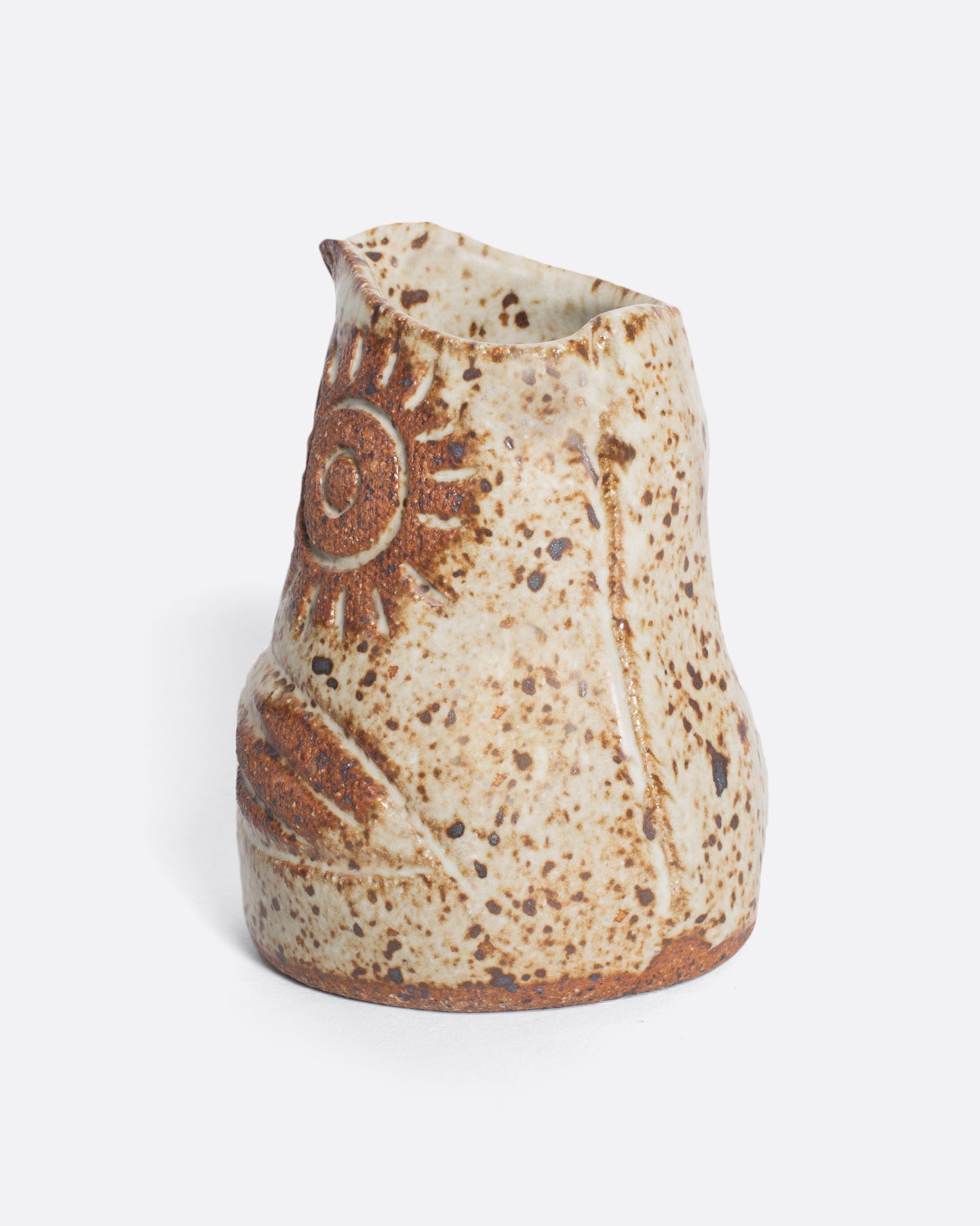 A handmade ceramic bird creamer, full of personality, with an impressionist design and speckled, satin glaze.