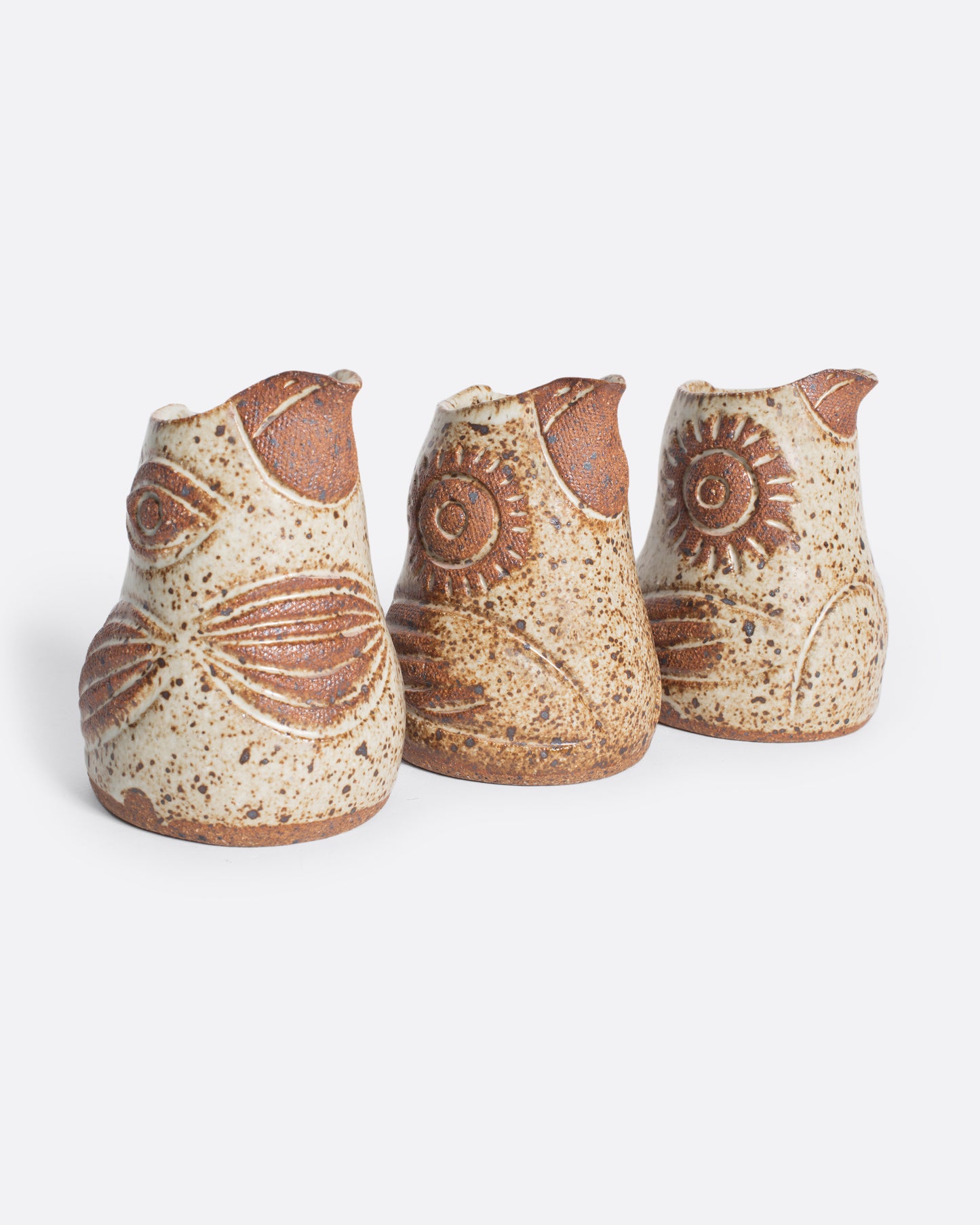 A handmade ceramic bird creamer, full of personality, with an impressionist design and speckled, satin glaze.