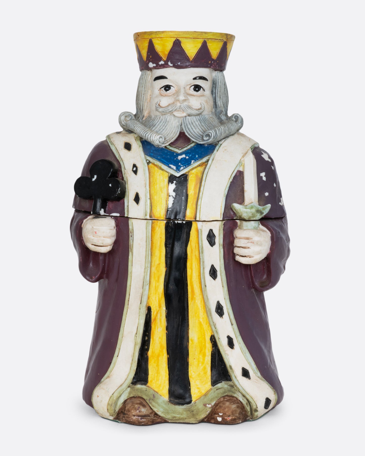 A card holder king of clubs figurine with a purple robe and crown, shown from the front.