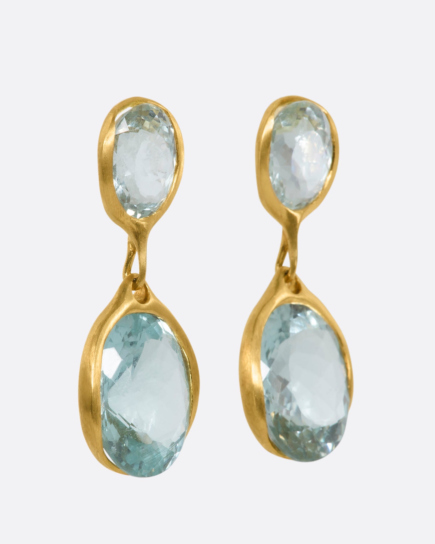 Yellow gold aquamarine stud double drops. View from the side.