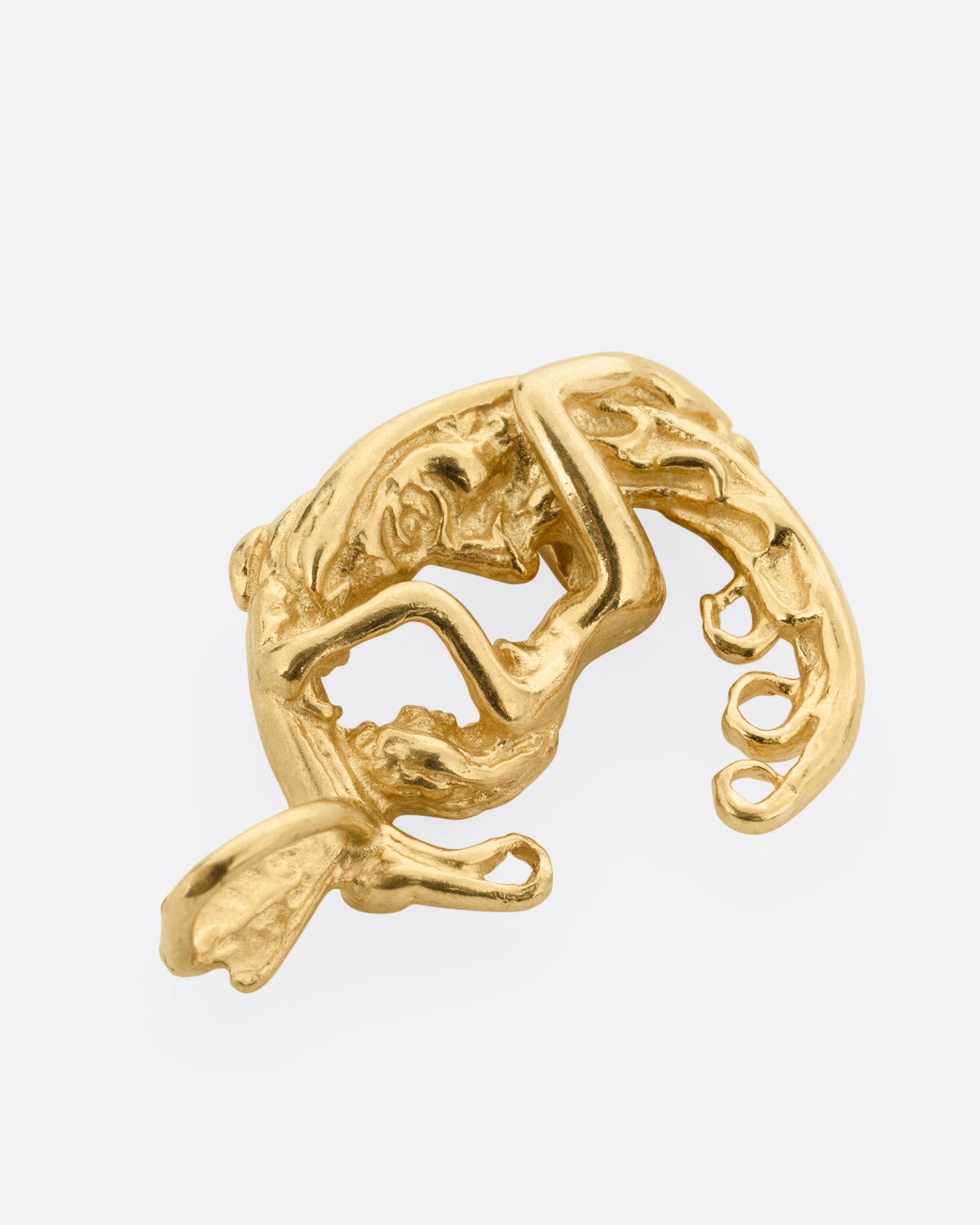 A yellow gold pendant with a woman astride a crescent moon. Shown from the front lying flat.