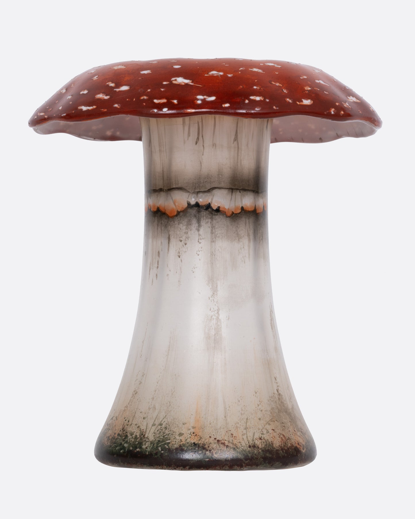 A hand painted red and white glass mushroom vase, shown from the front.