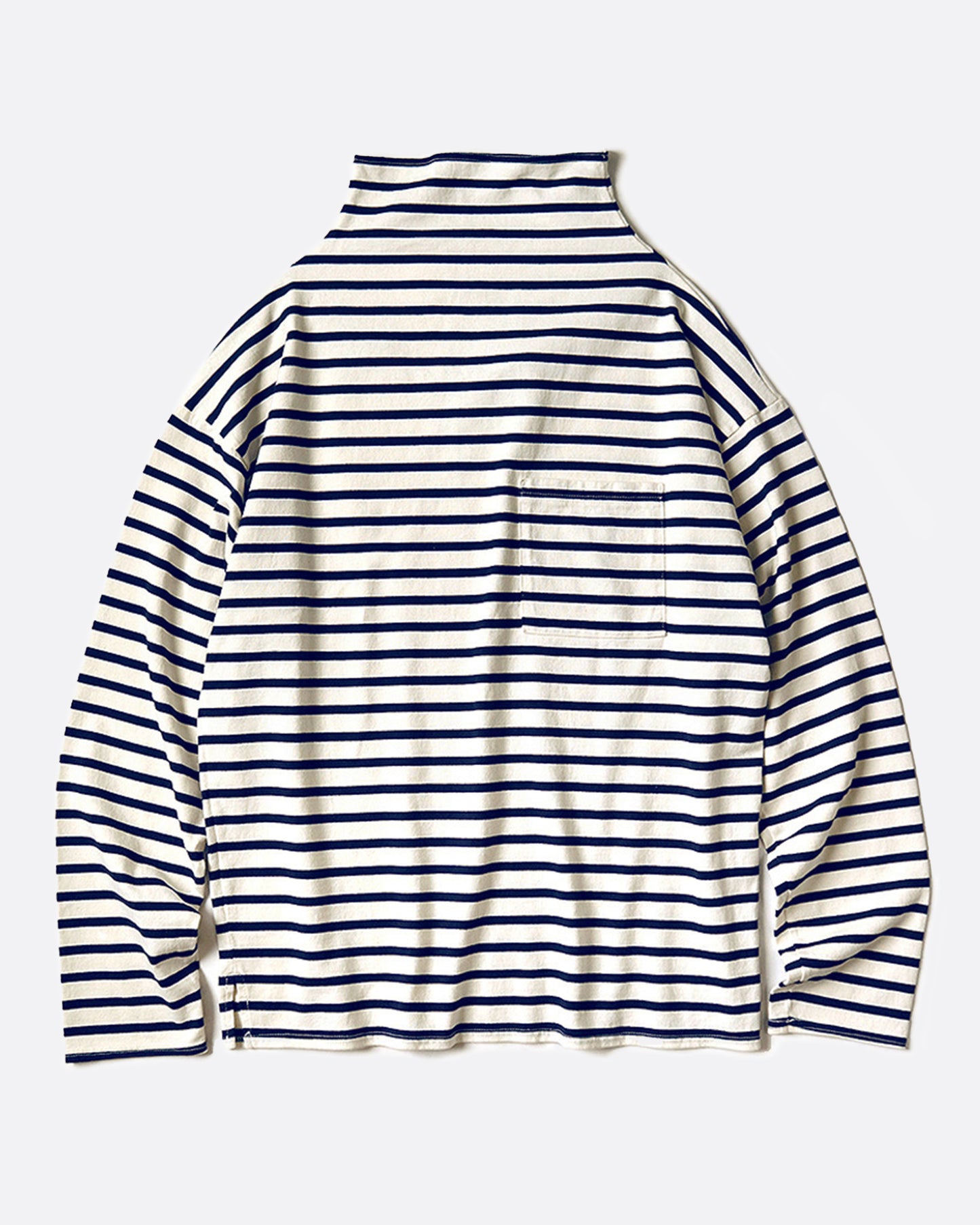 A white mock neck long sleeve shirt with navy horizontal stripes and a front pocket. Shown from the front.