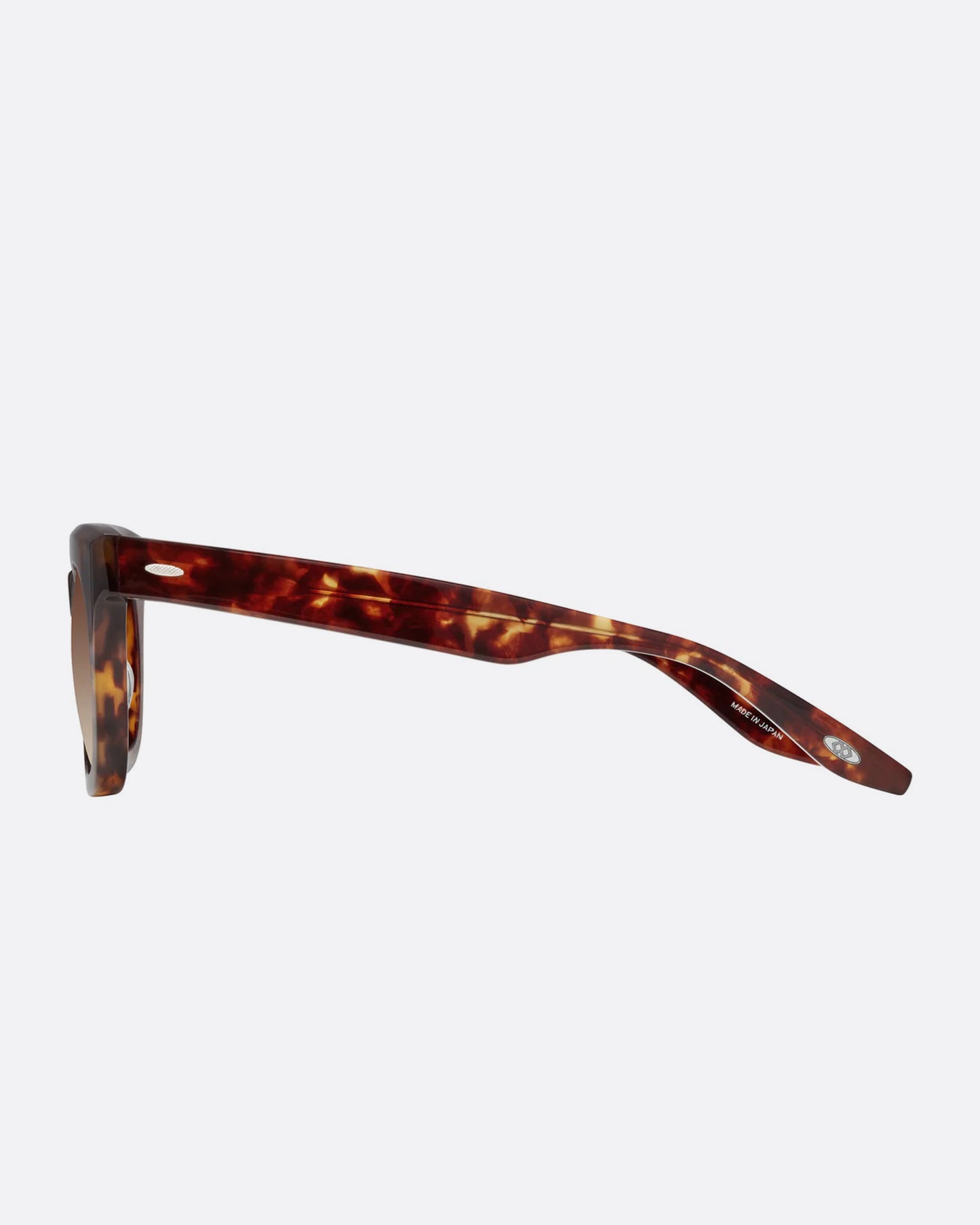 A pair of sunglasses with brown frames and brown gradient lenses. Shown from the side.