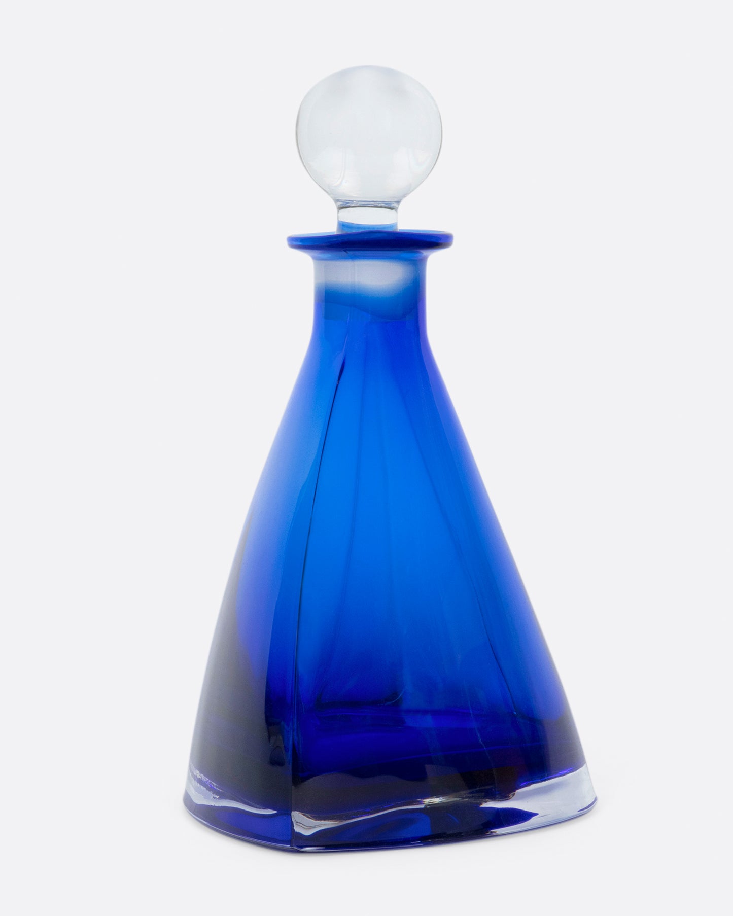 This heavy, heart-shaped bottle looks different from every angle.