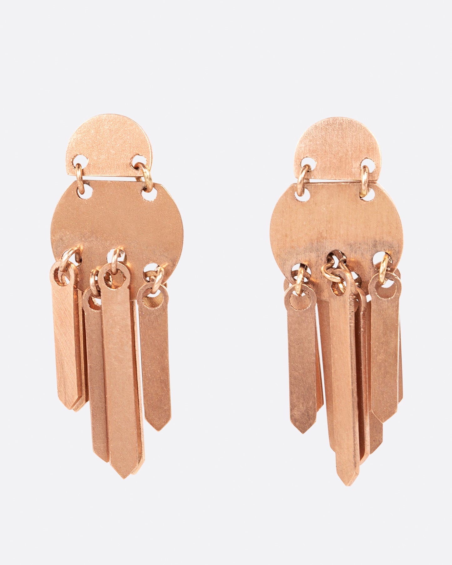 A pair of rose gold fringe earrings with two stacked circular tops. Shown from the front.
