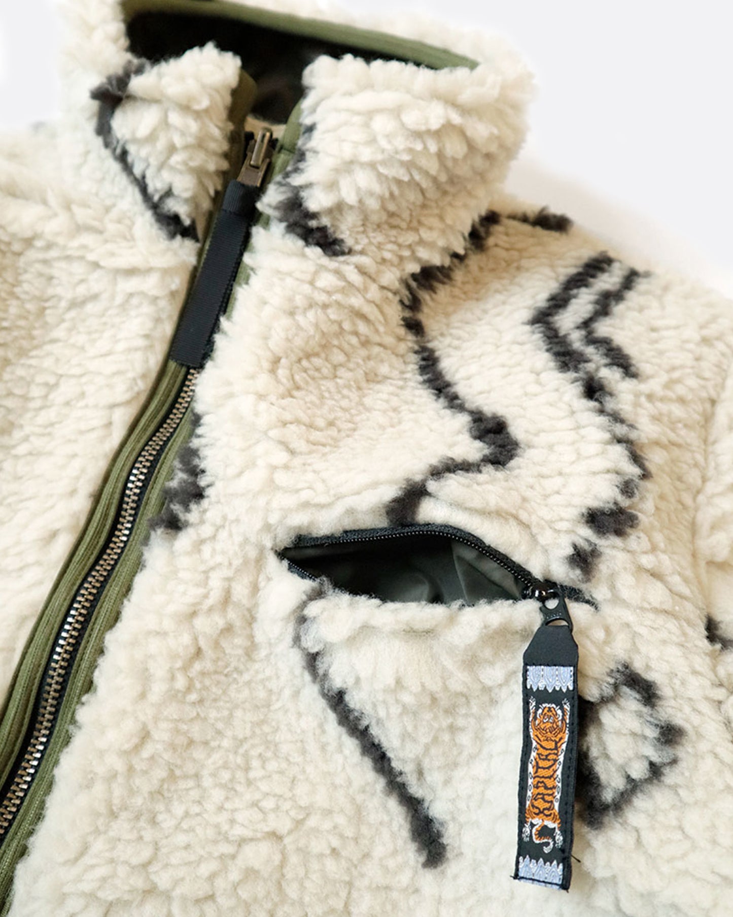 A close up of the collar of the fleece side of the reversible Beni Ourain jacket.