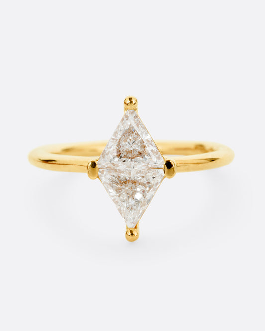 A yellow gold ring with two triangular diamonds mirroring each other. Shown from the front.