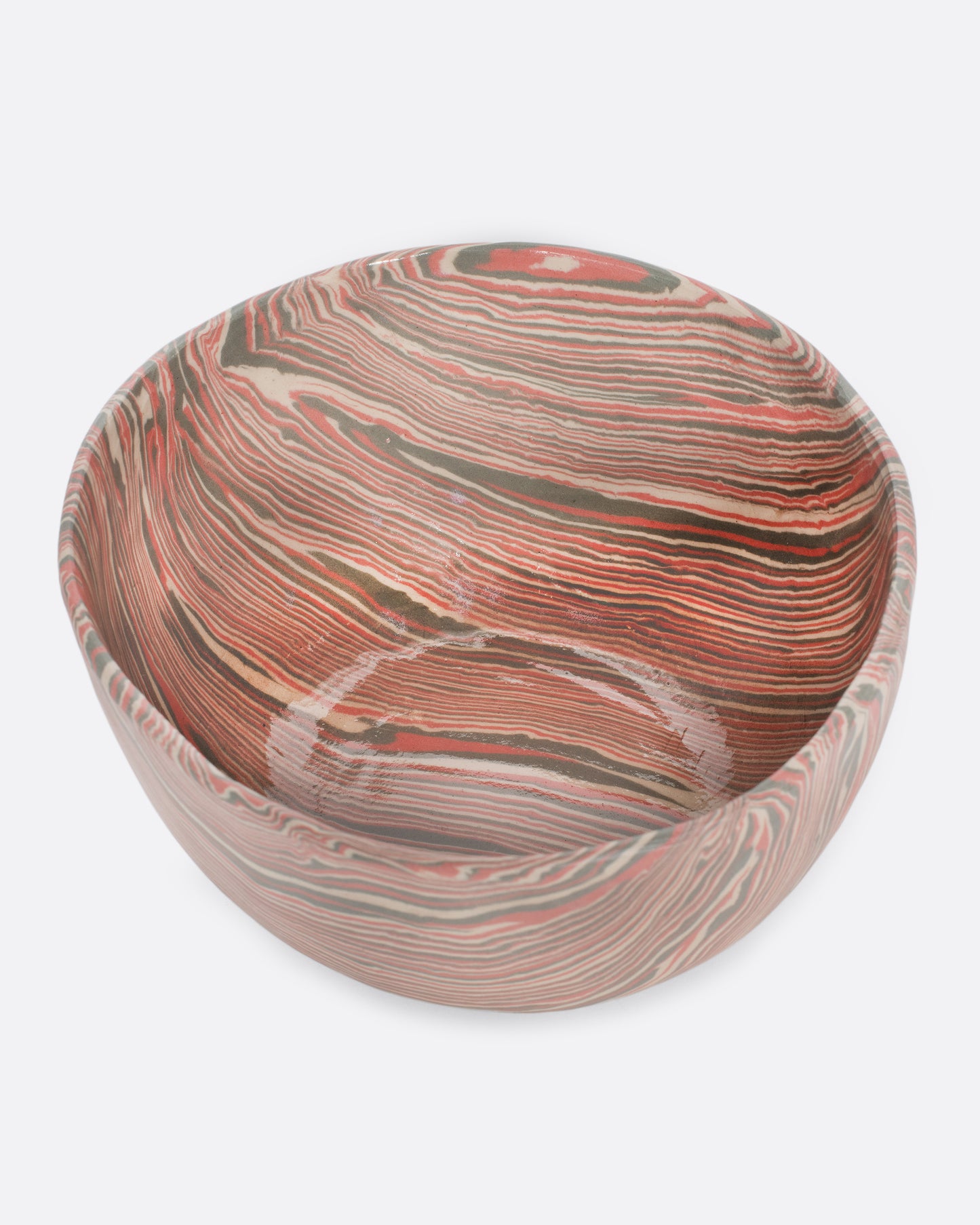 These small-batch ceramic bowls are made with a traditional Japanese nerikomi technique that creates an intricate, marbled design by layering and compressing clay. This timeless style feels plucked from desert sandstone with flowing hues of pink, white, and grey. Available in small, medium, and large sizes.