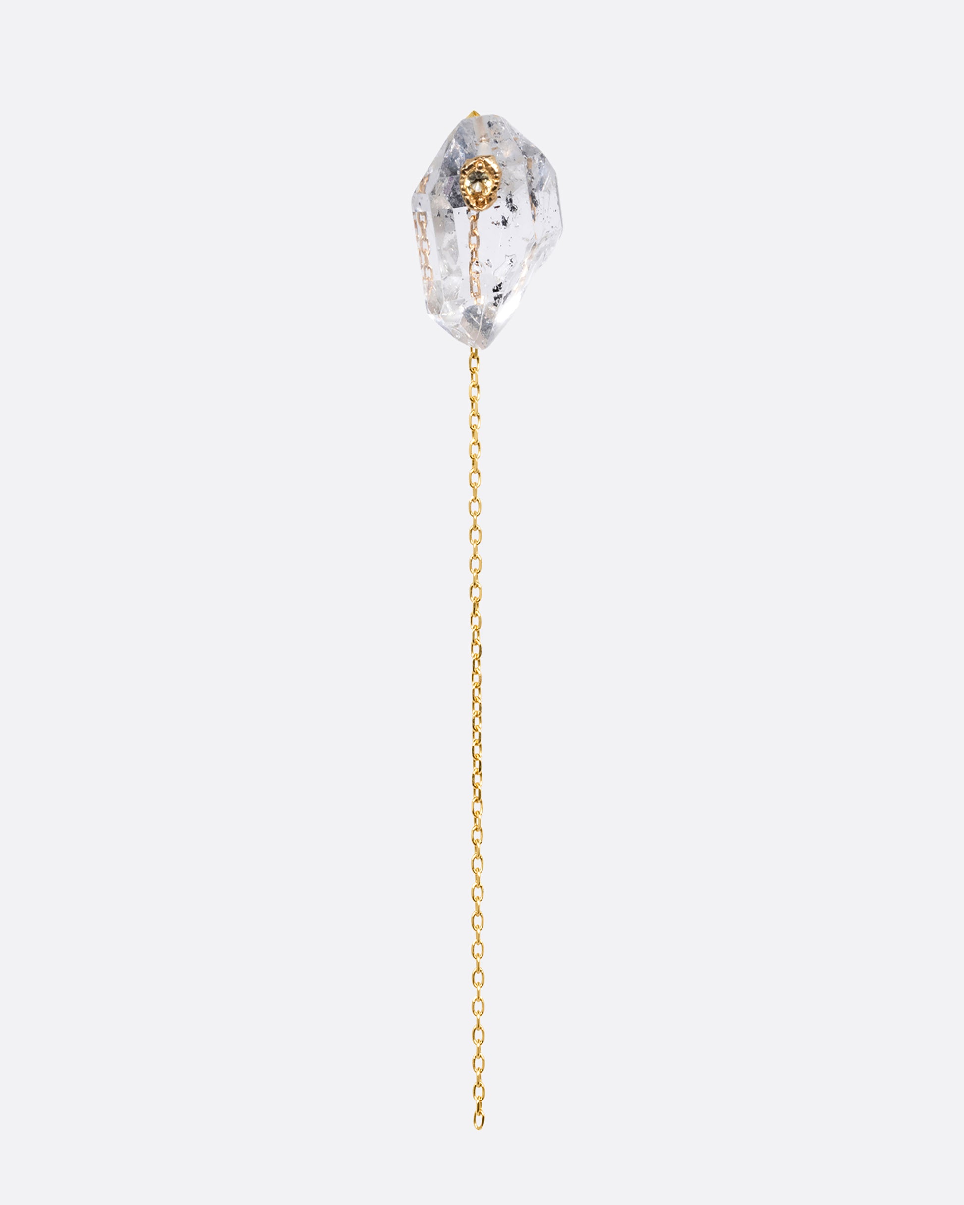 A pin and chain earring with a quartz and cable chain. Shown from the front.