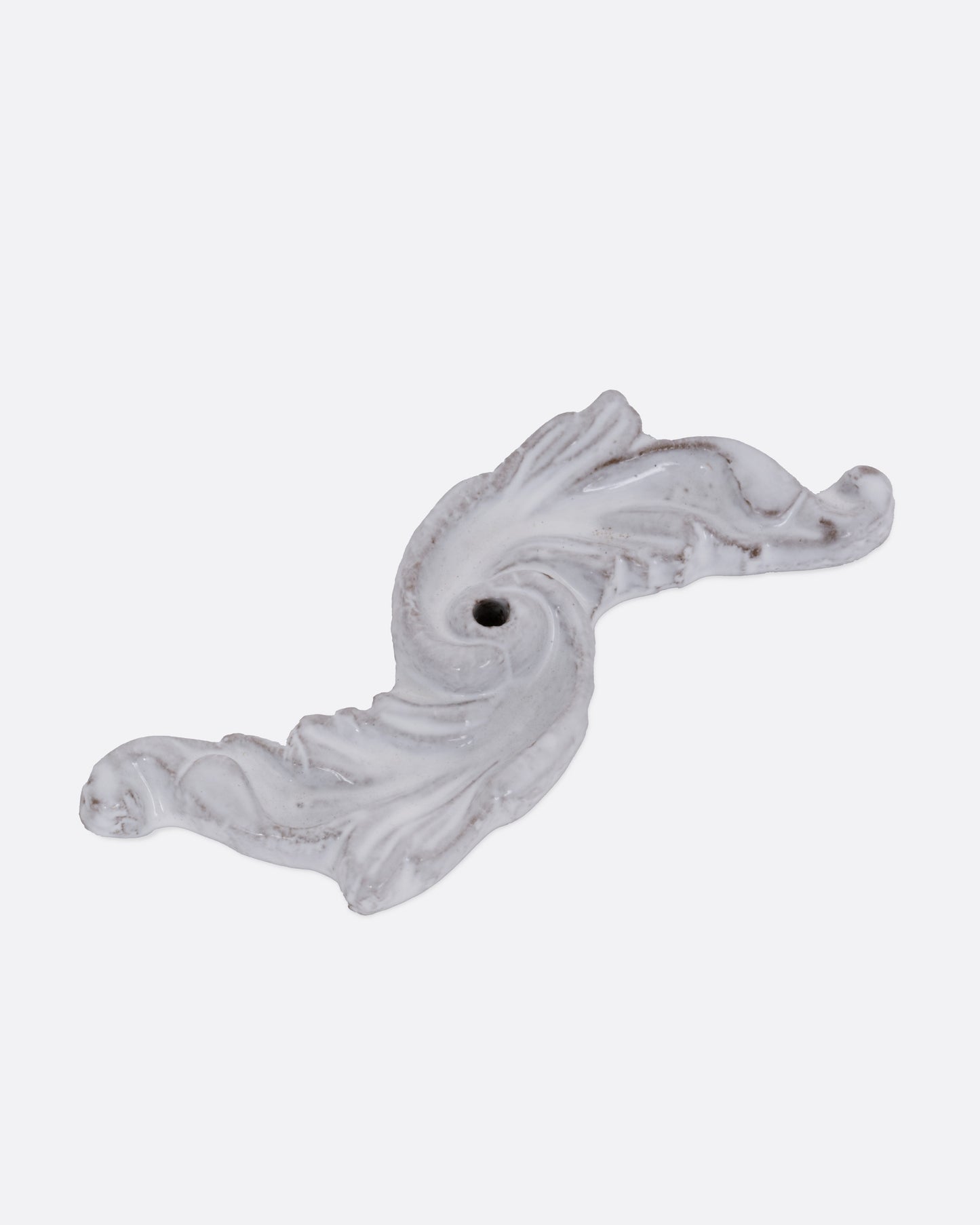 A white ceramic floral shaped incense burner, shown from the top.