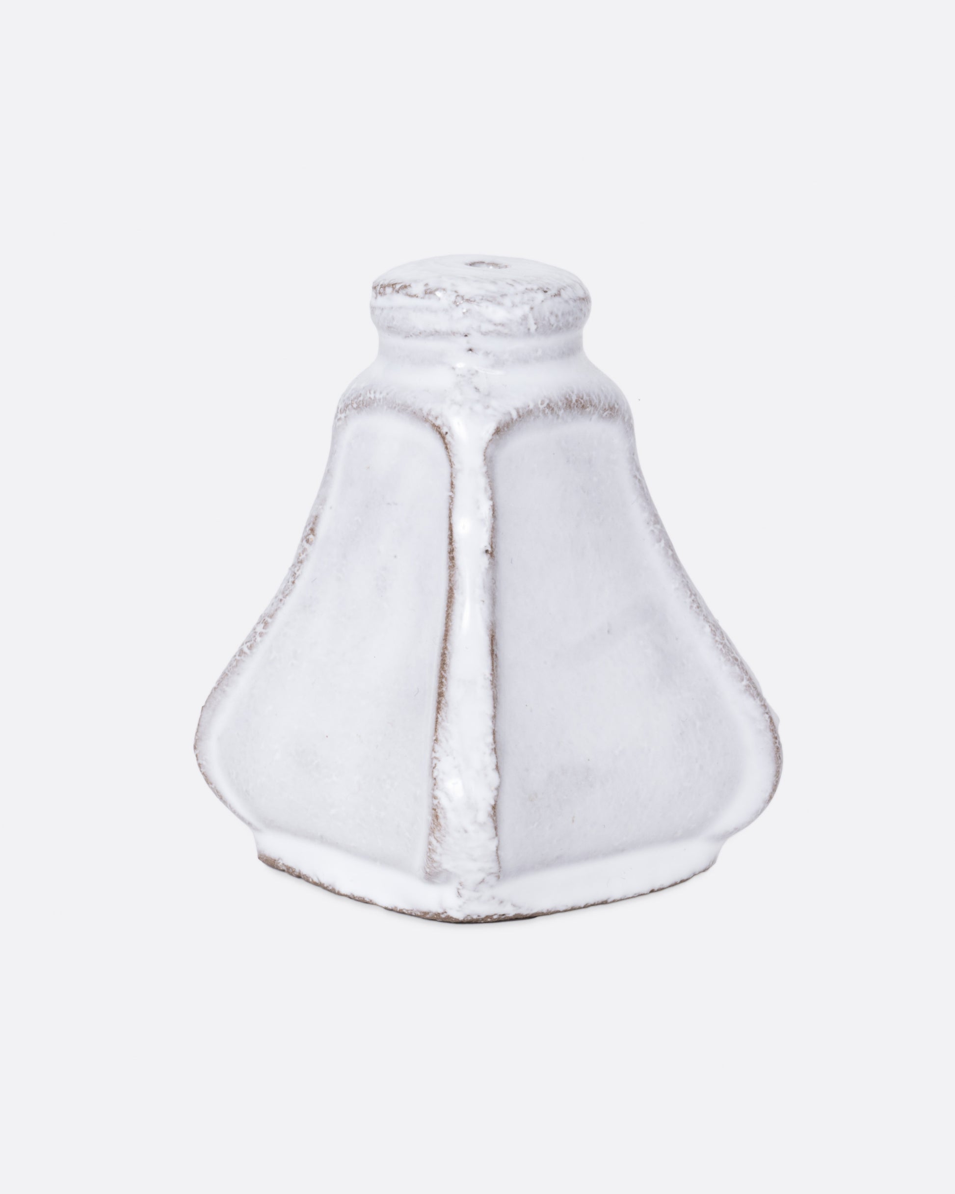 A white ceramic salt and pepper shaped incense burner, shown from the side.