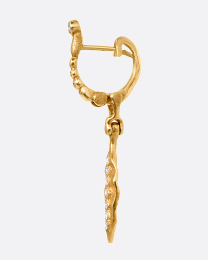 Yellow gold diamond leaf drop earrings, side view of one earring showing the hinged lever back