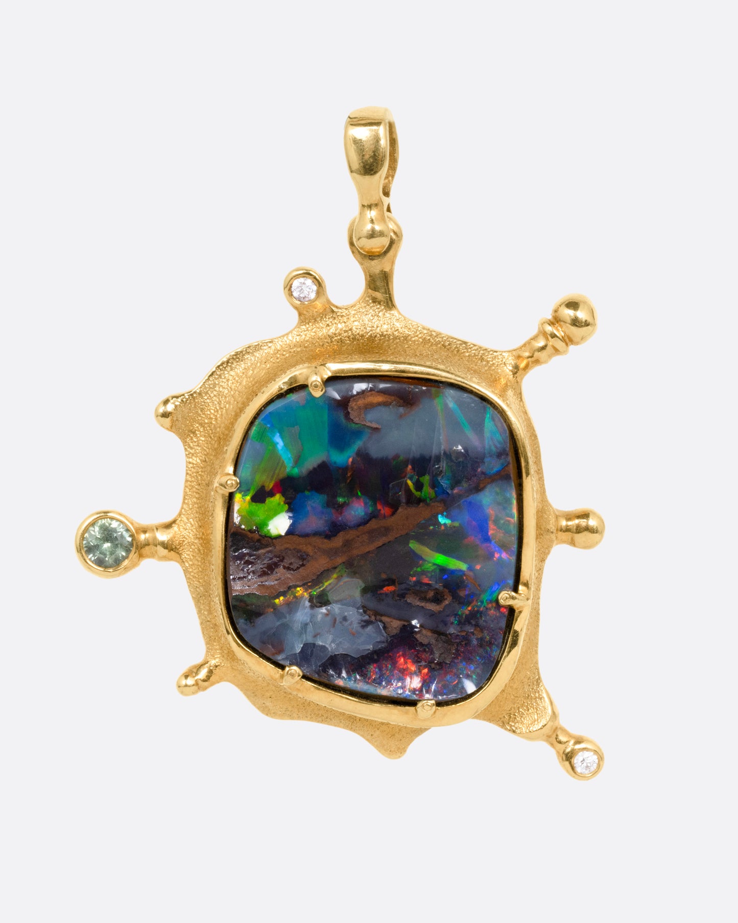 A yellow gold pendant with a boulder opal and diamonds and sapphires along its edges, shown from the front.