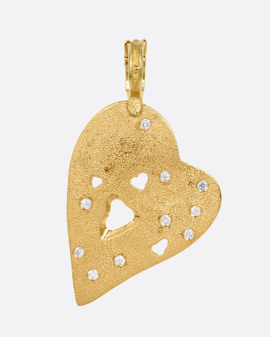A yellow gold heart shaped pendant with diamond accents. Shown from the front.