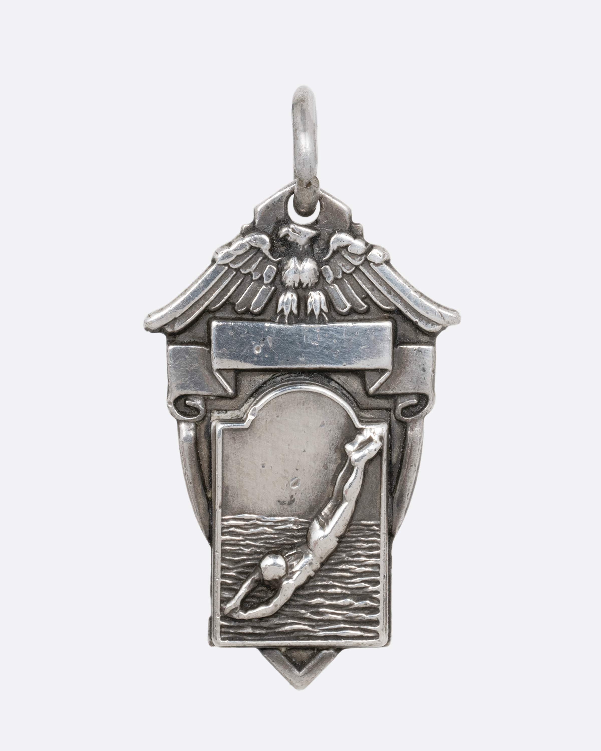 SWIMMER CREST PENDANT