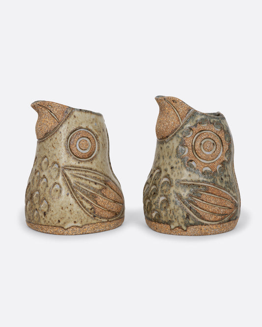 Two bird spotted bird shaped creamers. Shown from the side.