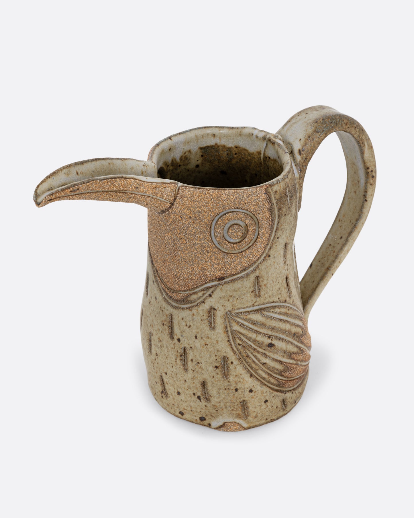 A toucan shaped pitcher with a handle. Shown diagonally from the top.