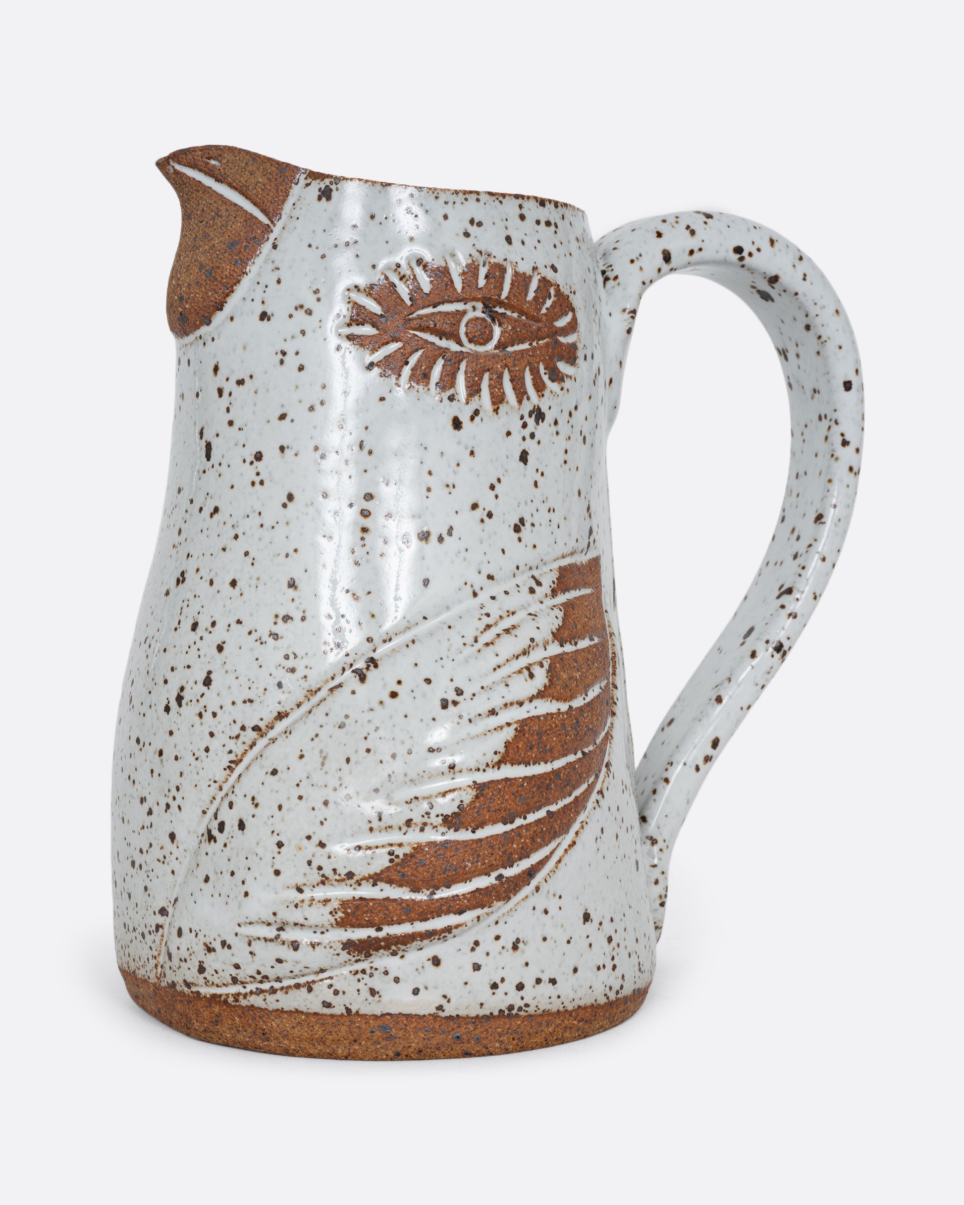 A white bird shaped pitcher with a handle. Shown from the side.