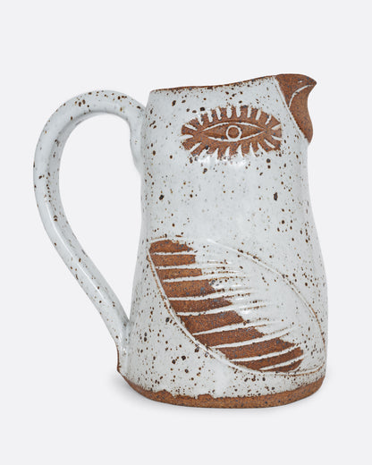 A white bird shaped pitcher with a handle. Shown from the side.