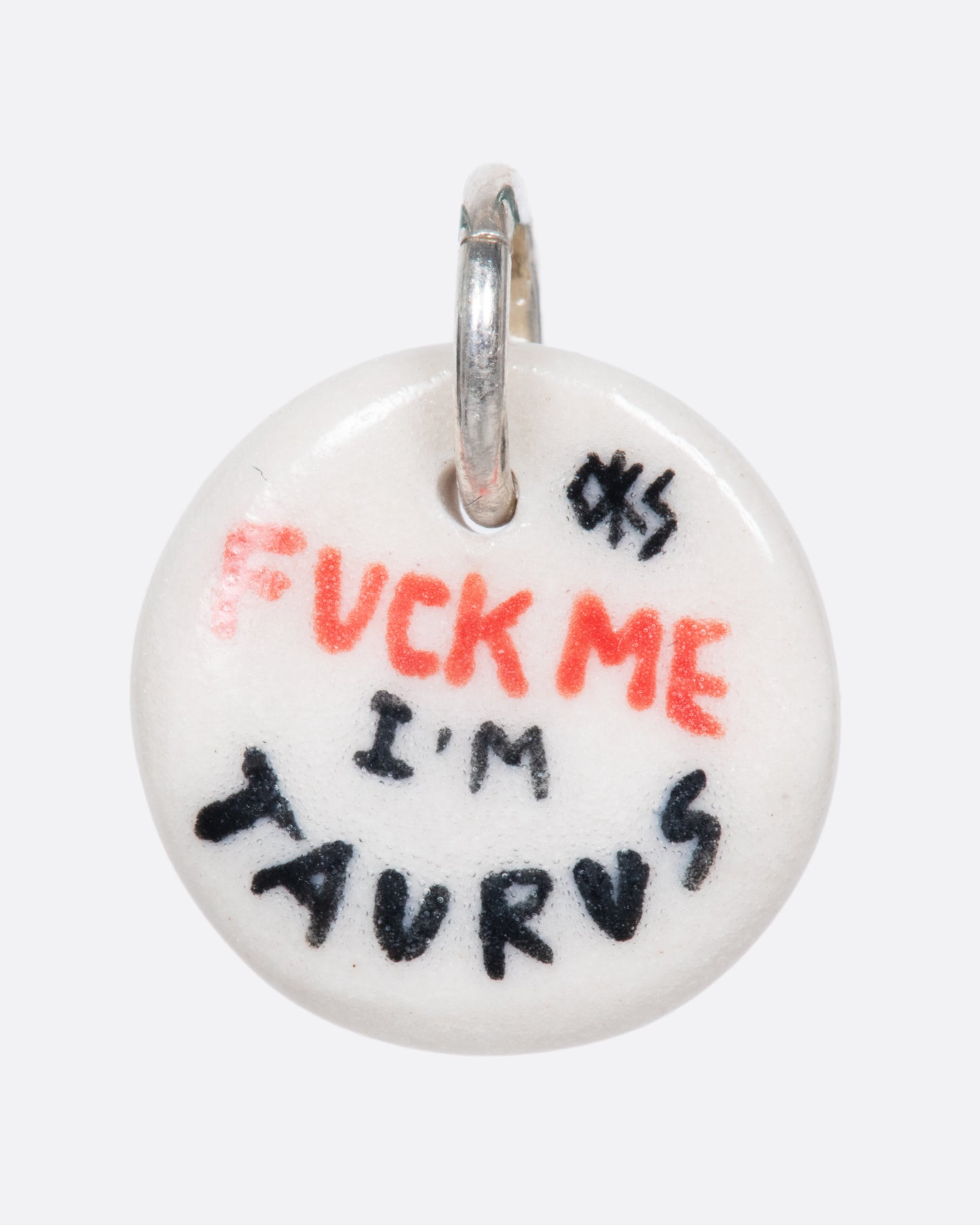 A handmade and painted porcelain zodiac disc charm with a sterling silver bail, featuring a sex position specific to each zodiac.