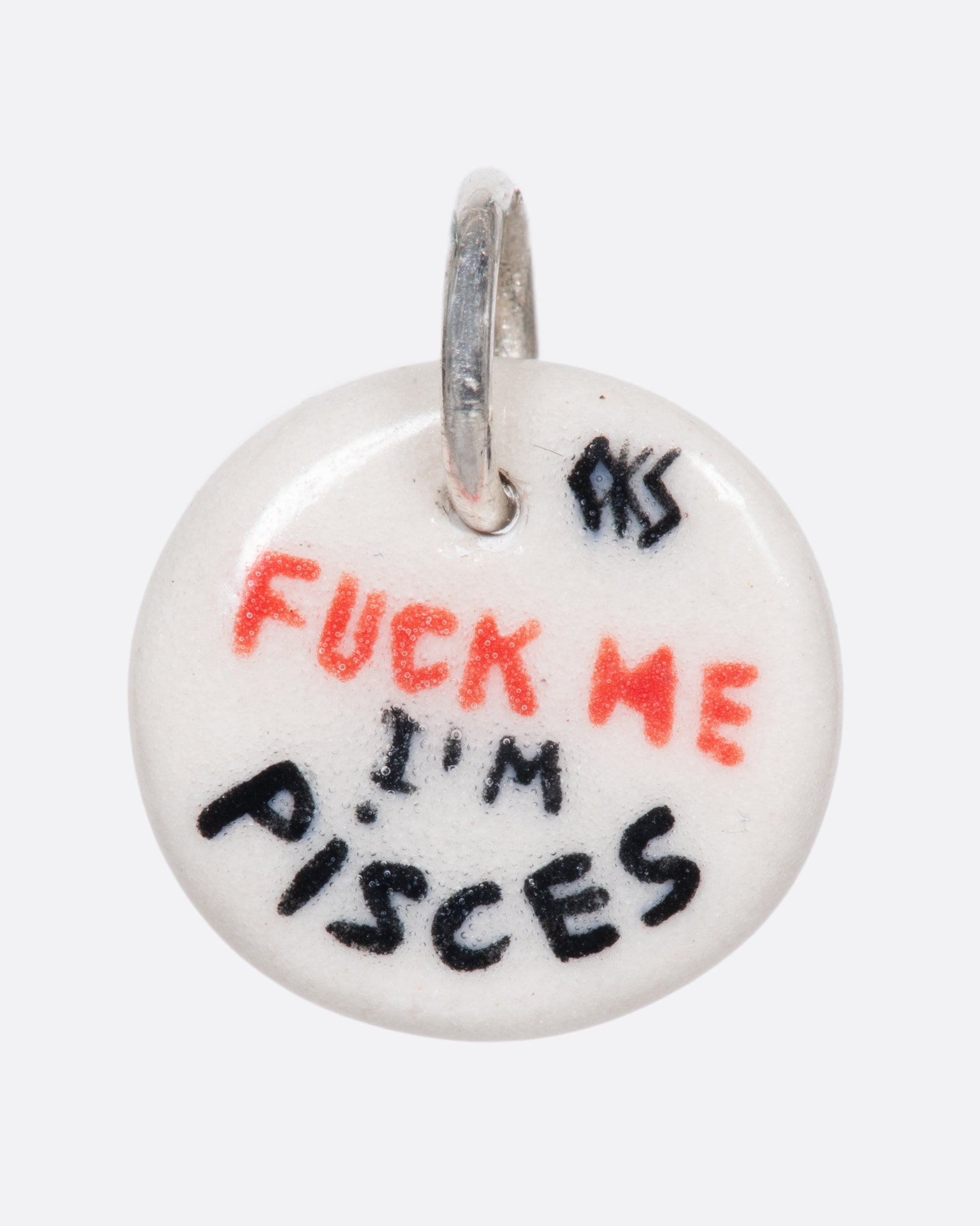 A handmade and painted porcelain zodiac disc charm with a sterling silver bail, featuring a sex position specific to each zodiac.