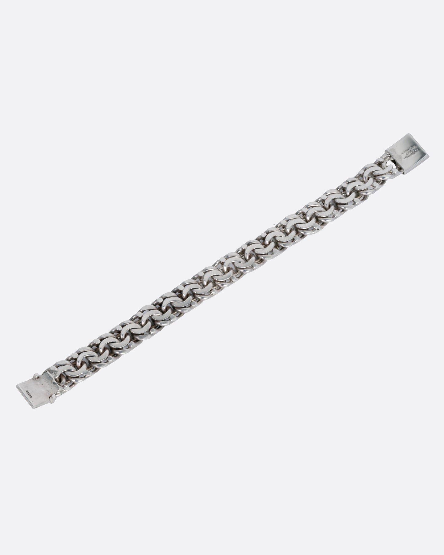 A silver flat double link bracelet, shown from the back.