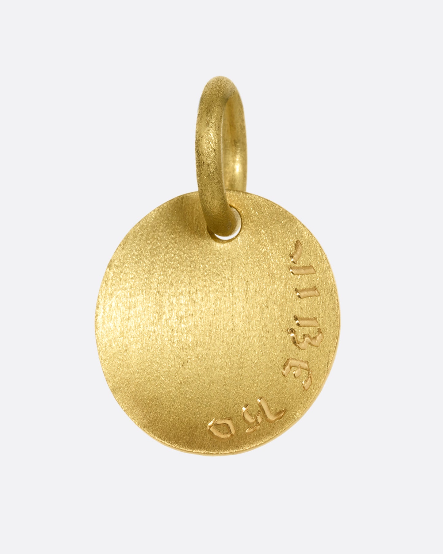 A yellow gold medallion with a diamond eyed bug with blue enamel striped wings. Shown from the back.