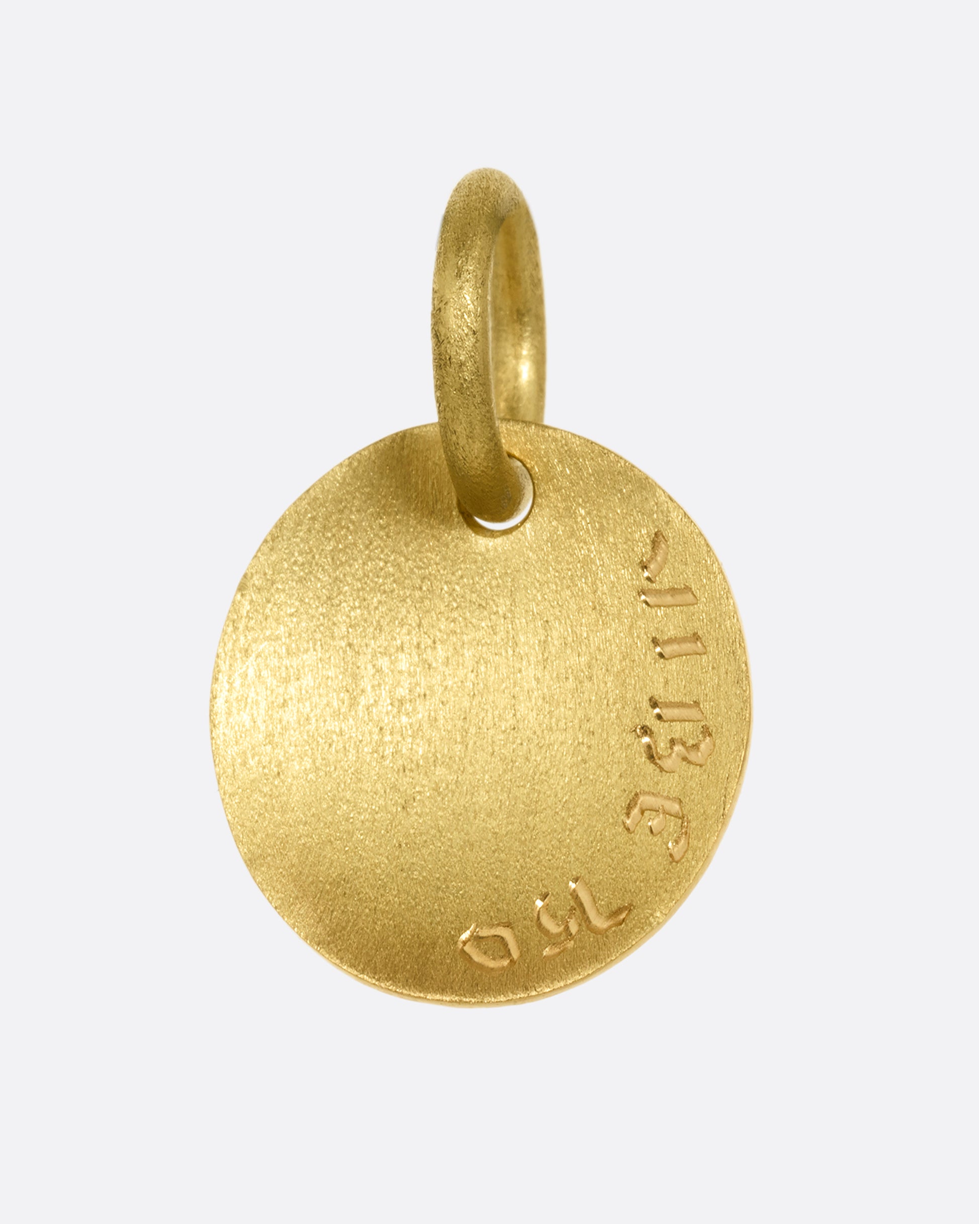 A yellow gold medallion with a diamond eyed bug with blue enamel striped wings. Shown from the back.