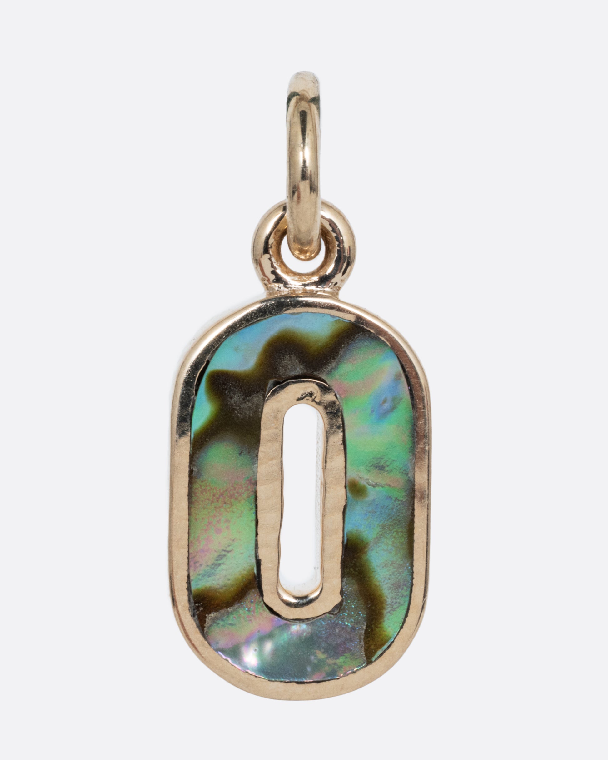 An abalone O charm set in yellow gold with a yellow gold jump ring and hoop. Shown from the front.