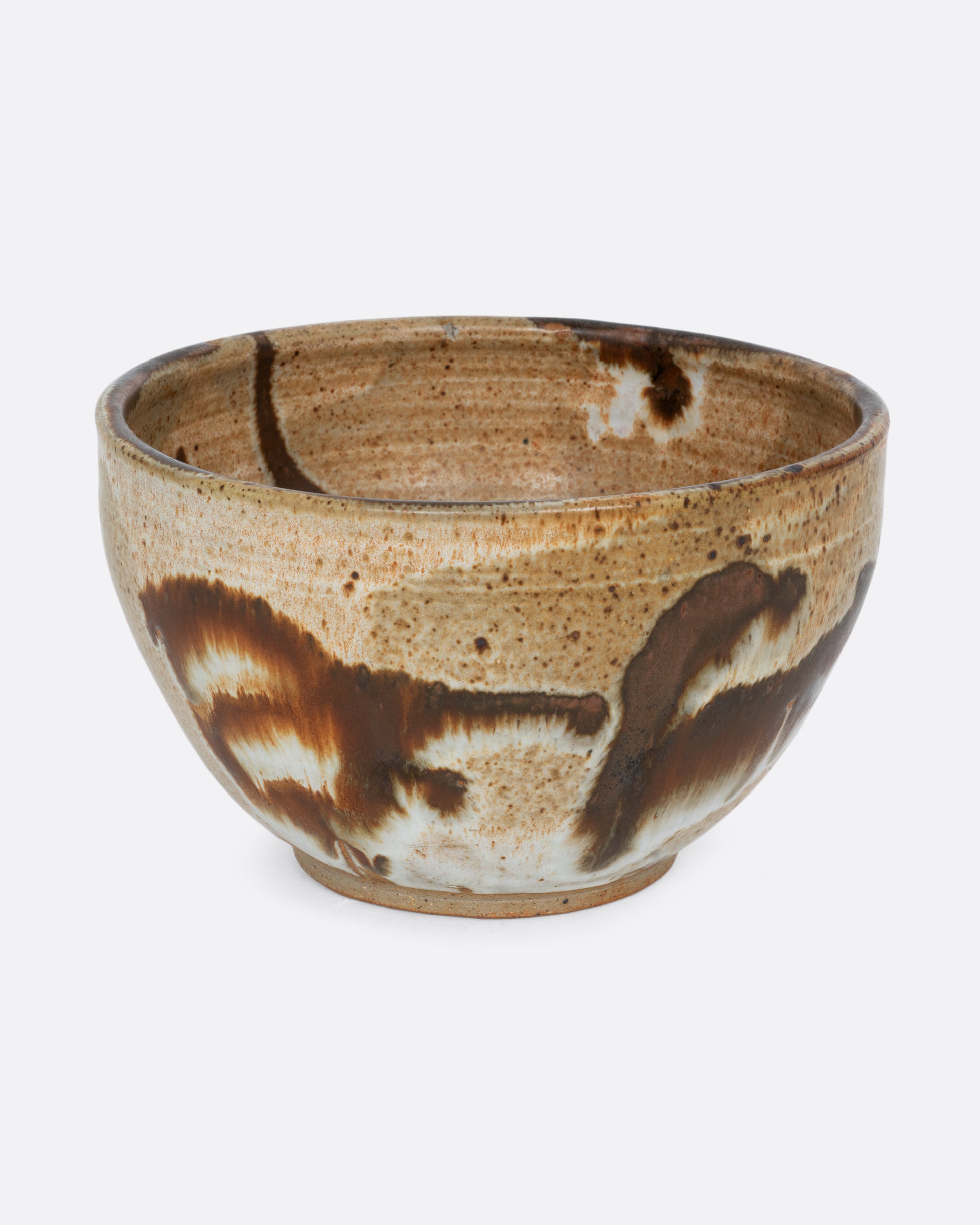A brown bowl with brown brushstrokes all over. Shown from the front.
