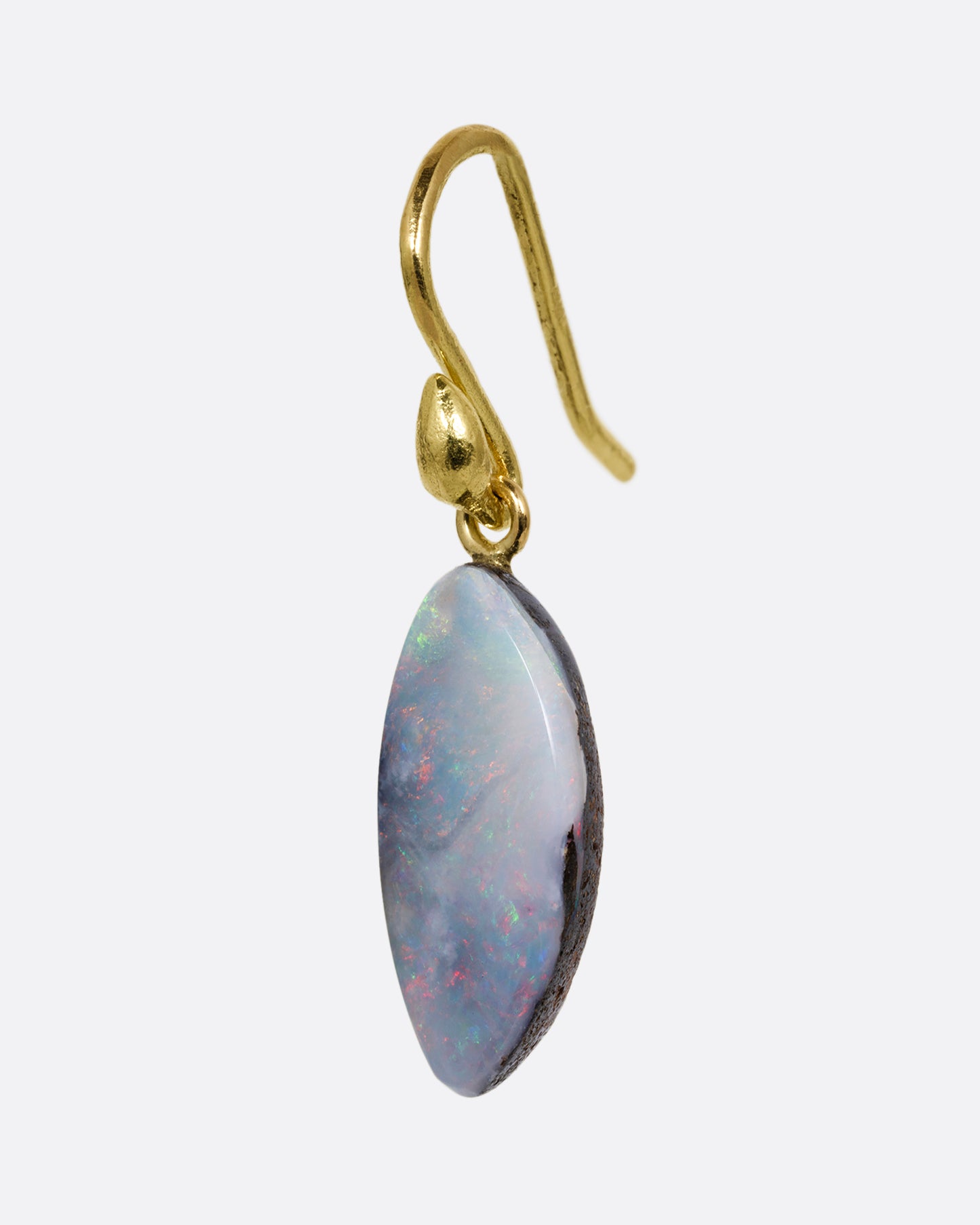 A single wing shaped opal with a yellow gold ear hook. Shown from the side.