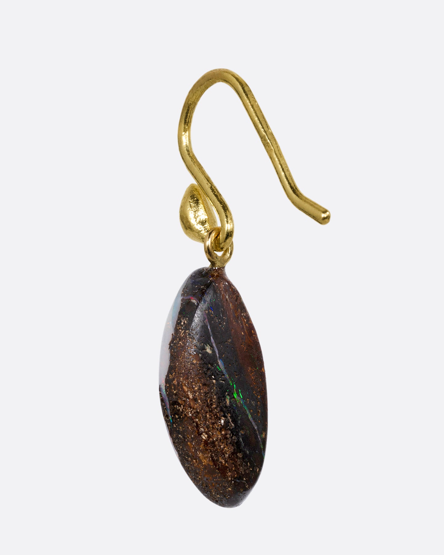 A single wing shaped opal with a yellow gold ear hook. Shown from the back.