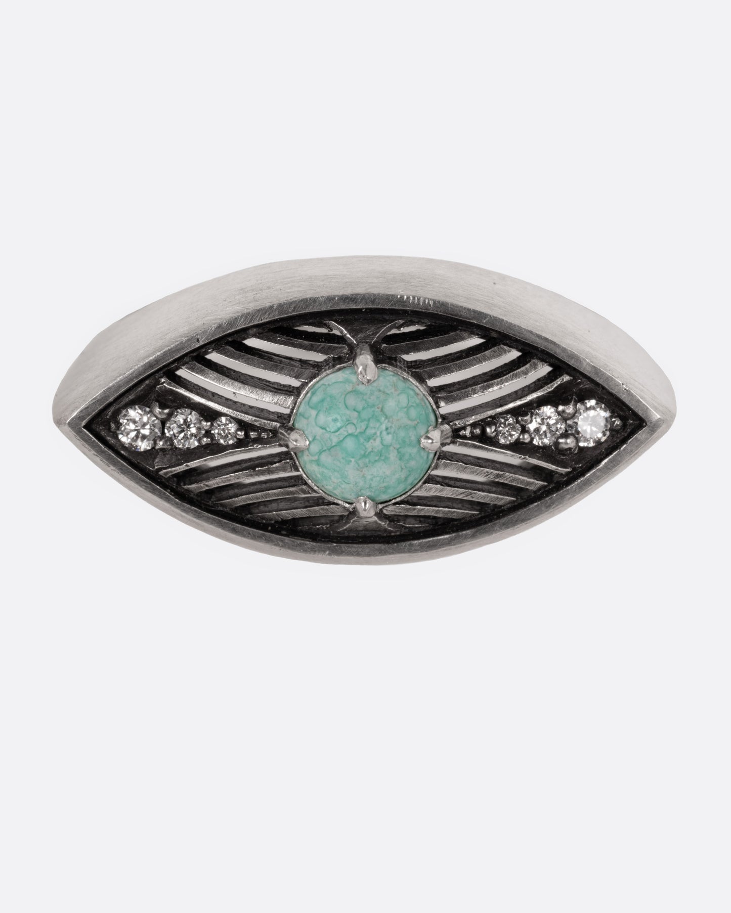 A silver eye shaped ring with a marbled Mexican turquoise cabochon and diamond details, shown from the front.