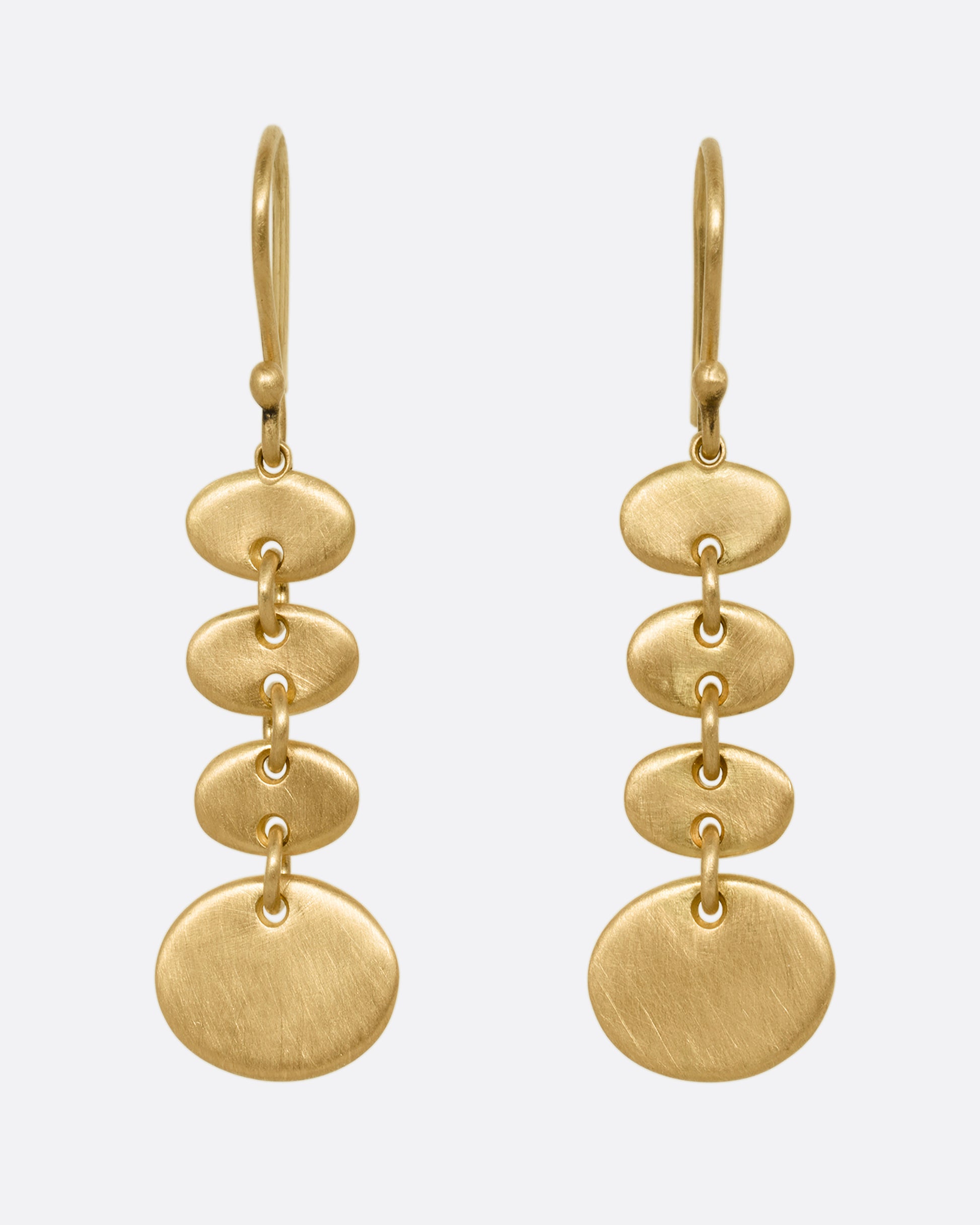 A yellow gold pair of earrings with linked graduated ovals. Shown from the front.