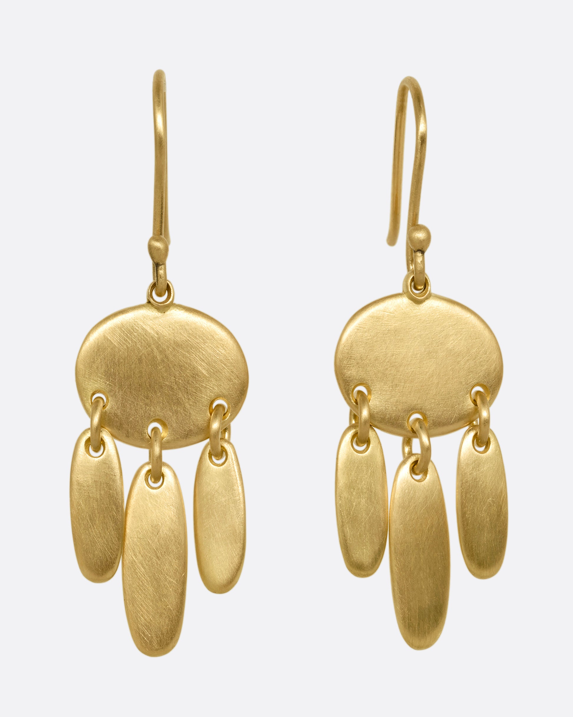 A pair of yellow gold earrings; each with one horizontal oval and  three vertical ovals hanging from links. Shown from the front.