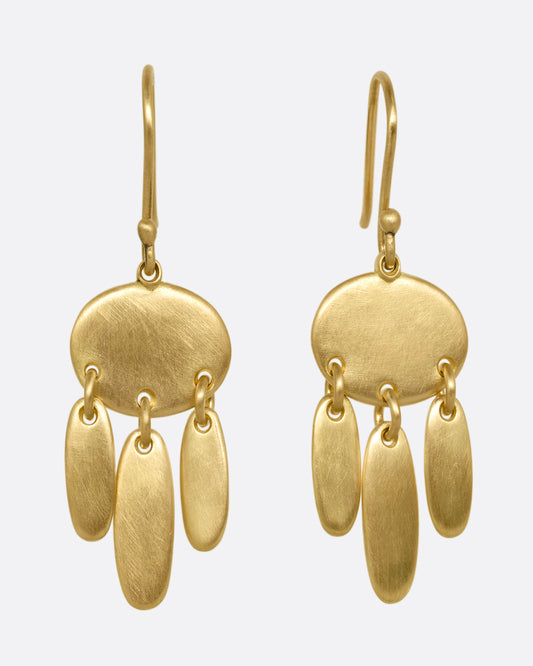 A pair of yellow gold earrings; each with one horizontal oval and  three vertical ovals hanging from links. Shown from the front.