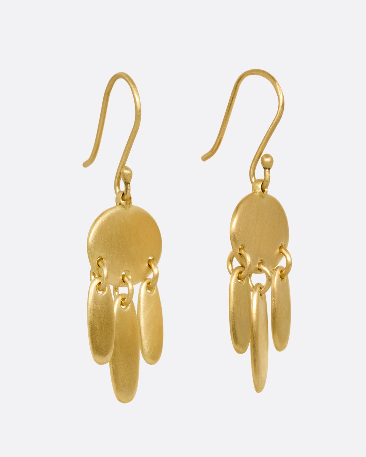 A pair of yellow gold earrings; each with one horizontal oval and  three vertical ovals hanging from links. Shown from the side.