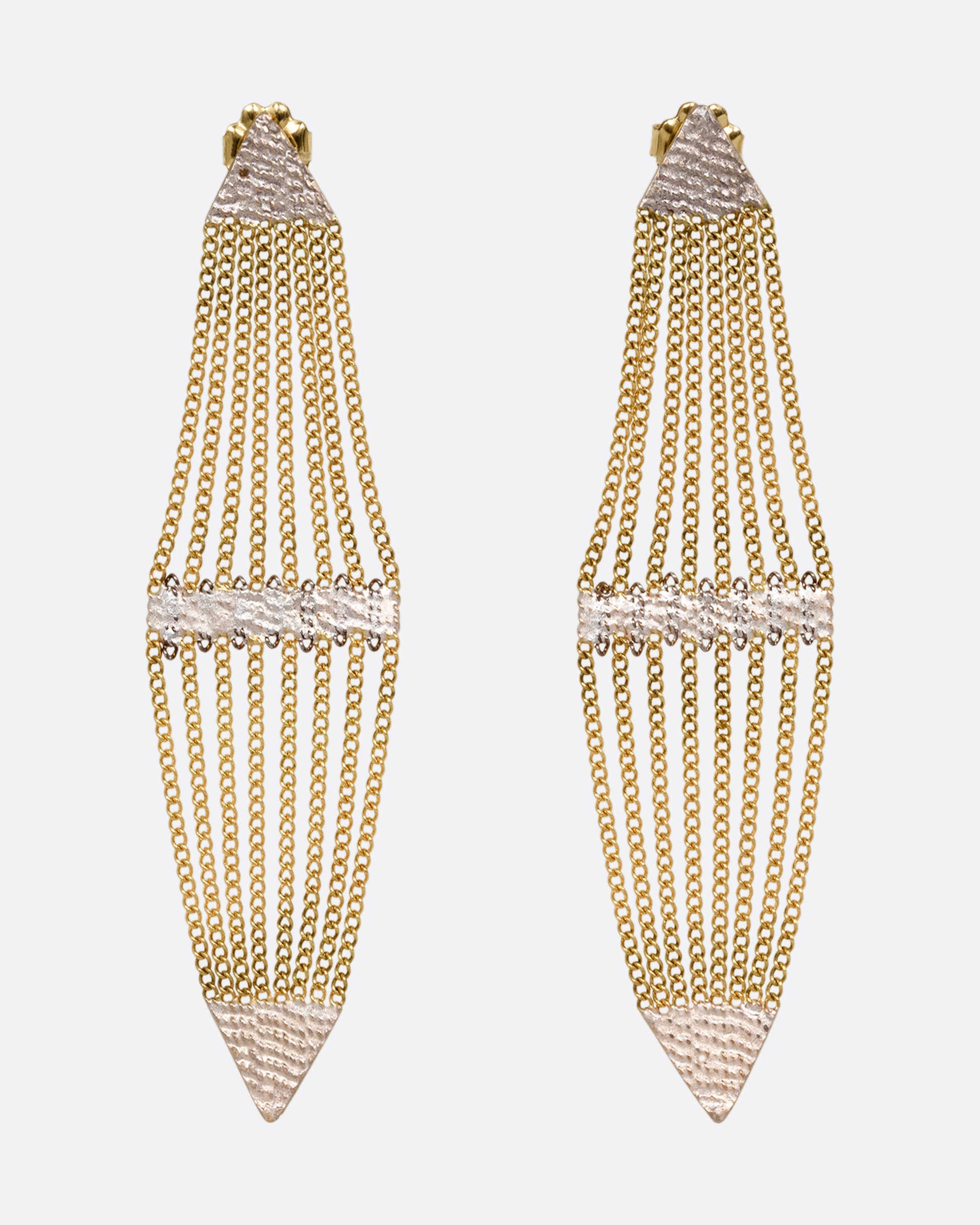 A pair of diamond shaped earrings with silver solder and yellow gold chain. Shown from the front.